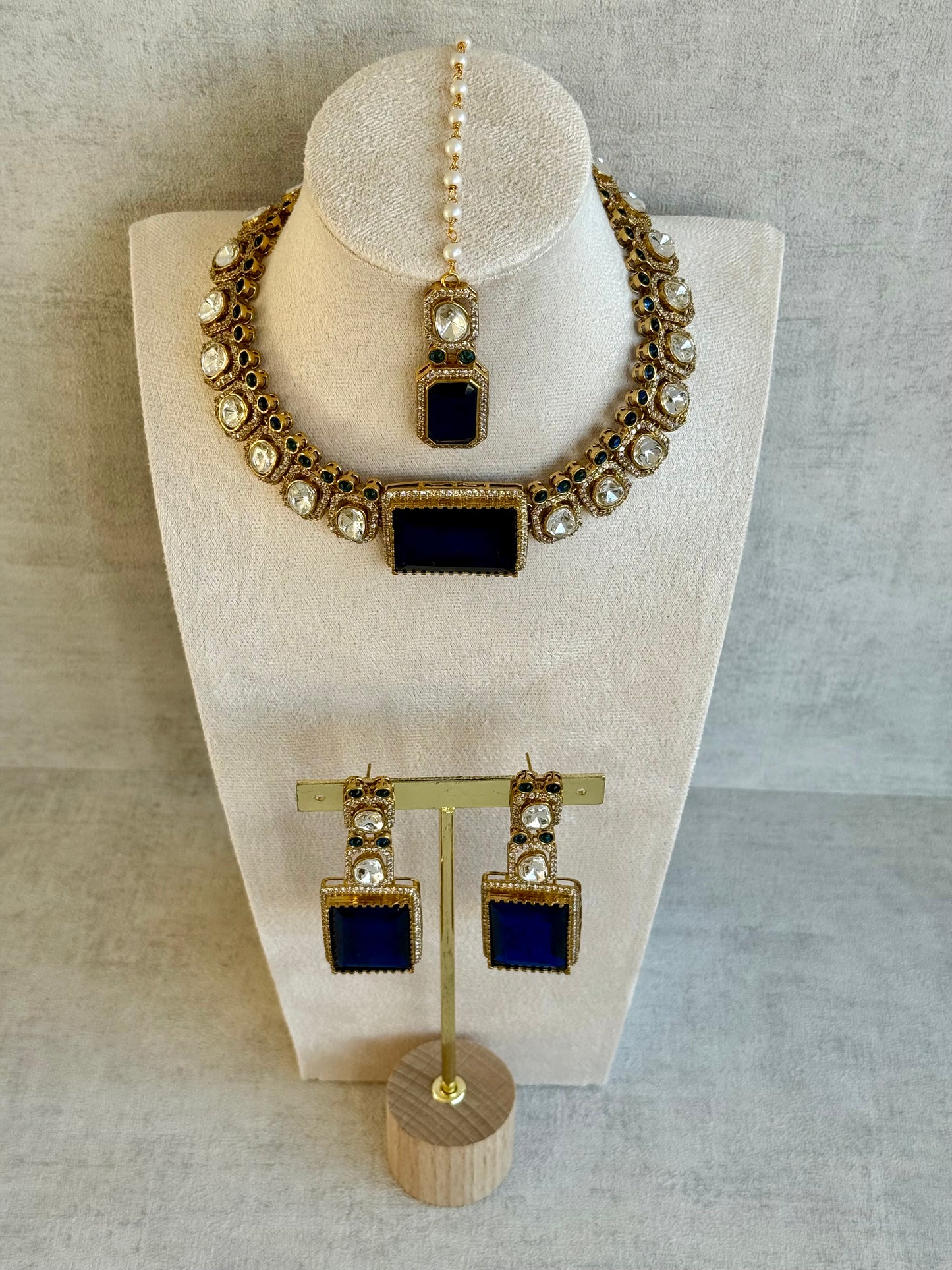 Ayura Designs Clara Set with Earrings & Tikka  – Royal Blue Stones with Moissanite and Antique Gold Finish