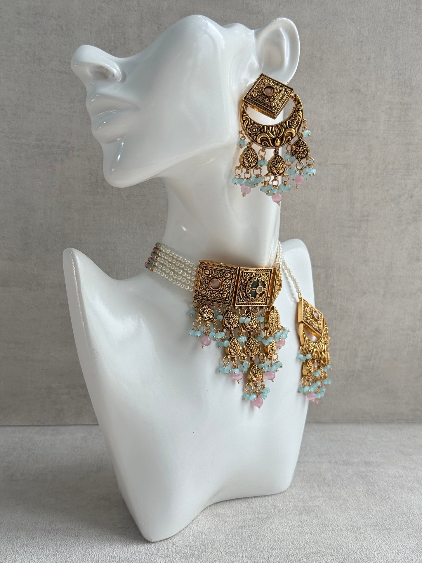 Ayura Designs Samera Choker Set with Earrings & Tikka – Aqua Blue & Blush Pink Beads, Green Centre Stone, Floral Motifs & Antique Gold Finish