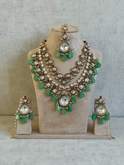 Ayura Designs Malika Bridal Set with Necklace, Jhumkis, Tikka, Nath, Ring & Sheeshphool – Jadau Kundan Craftsmanship with Mirror-Cut Polki, Jade-Toned Drops, Ruby Accents & Antique Gold Finish