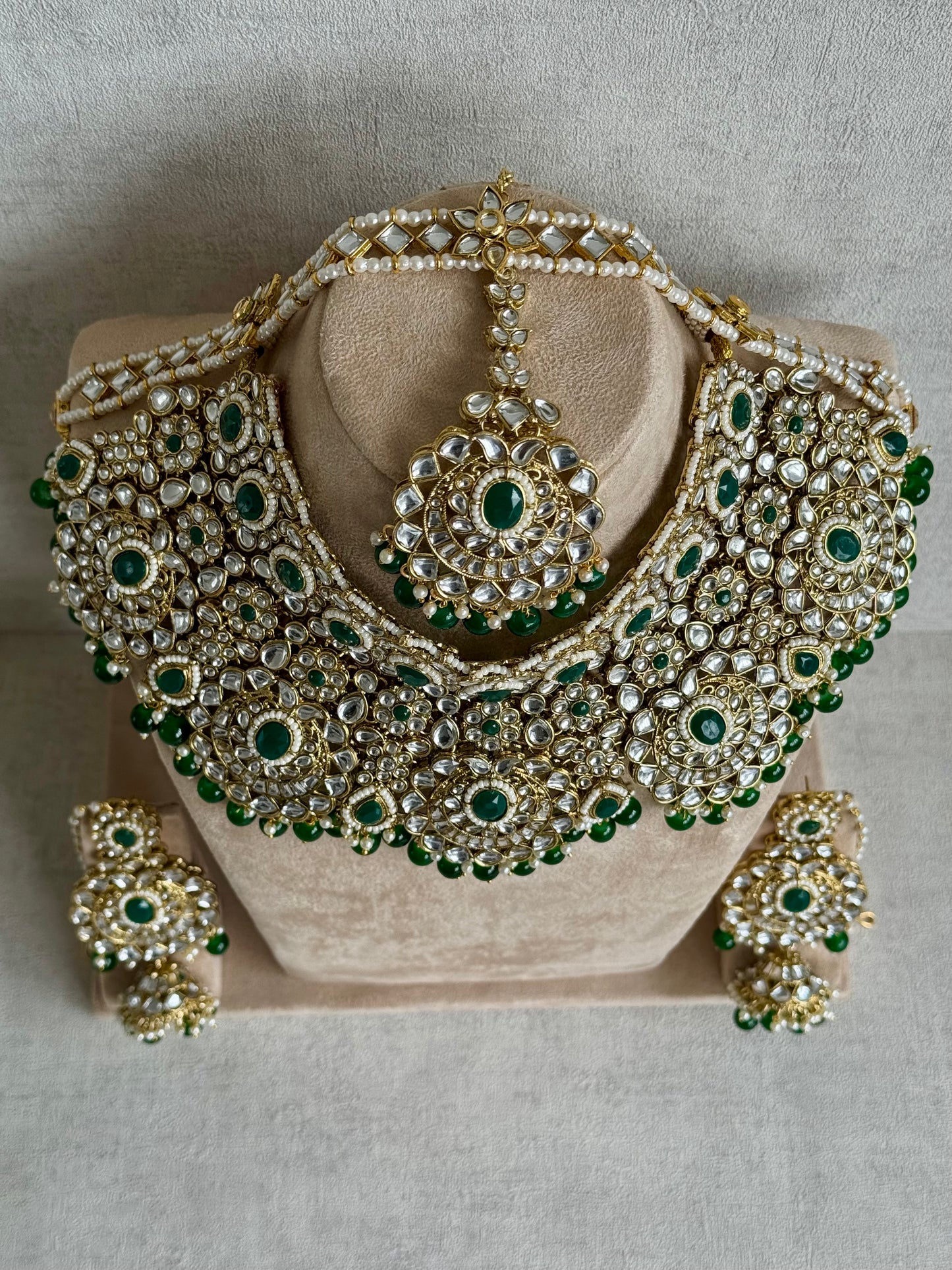 Ayura Designs Meherbano Bridal Set with Necklace, Jhumkis, Tikka, Nath, Ring & Sheeshphool – Jadau Kundan Craftsmanship with Mirror-Cut Polki, Emerald Green Stones & Antique Gold Finish
