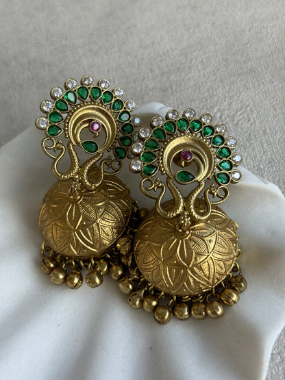 Ayura Designs Moraya Jhumkis – Emerald Green Peacock Motif with Antique Gold Detailing