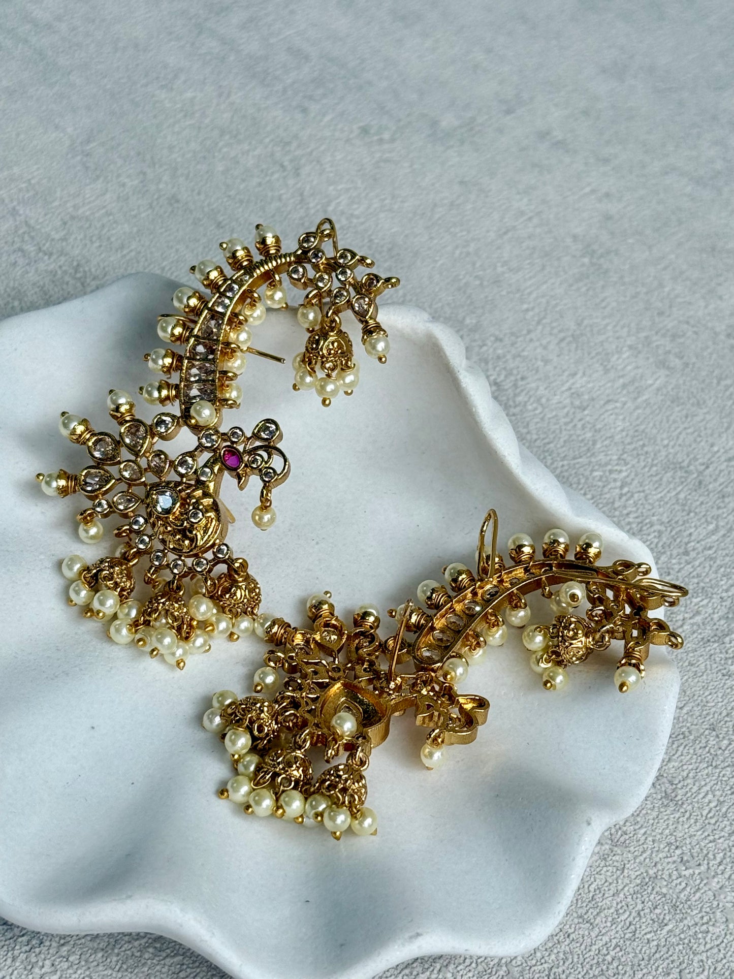 Ayura Designs Megha Half Ear Cuff Earrings – Gold Peacock Motif with Kundan Crystals, Pink Stone Accents & Pearl Jhumka Drops