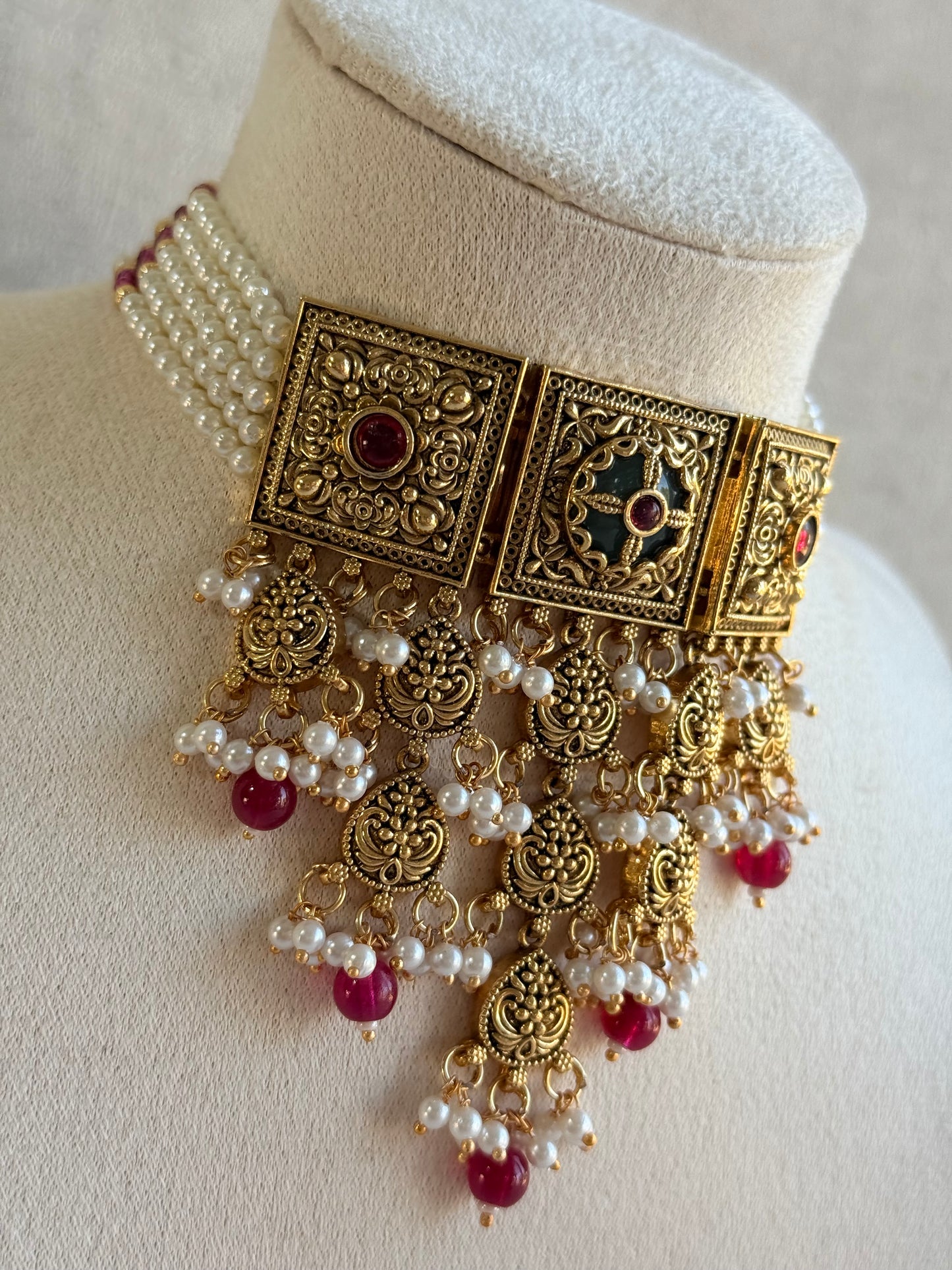 Ayura Designs Samera Choker Set with Earrings & Tikka – Rani Pink Beads, Pearl Detailing, Green Centre Stone, Floral Motifs & Antique Gold Finish