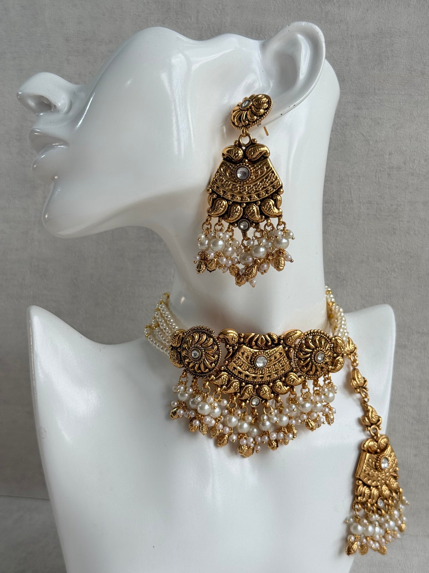 Ayura Designs Sairish Choker Set with Earrings & Tikka – Ivory Beads, Pearl Detailing, Ghungroos, Paisley Motifs & Antique Gold Finish