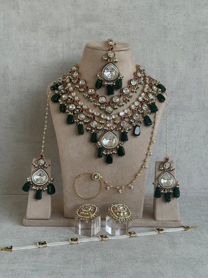 Ayura Designs Malika Bridal Set with Necklace, Jhumkis, Tikka, Nath, Ring & Sheeshphool – Jadau Kundan Craftsmanship with Mirror-Cut Polki, Emerald Green Drops, Ruby Accents & Antique Gold Finish