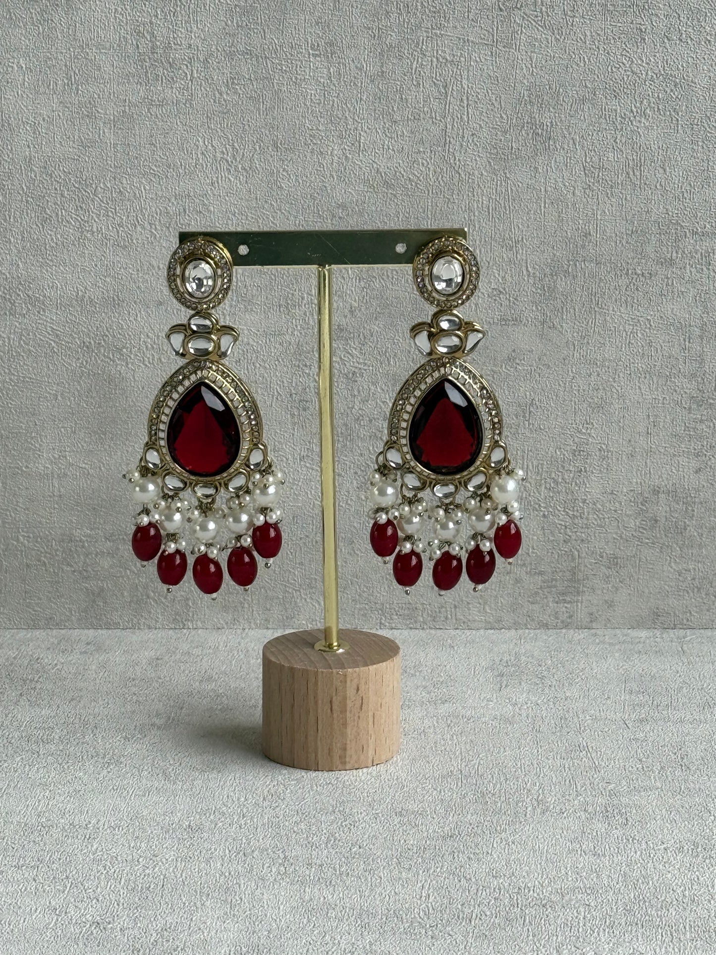 Ayura Designs Nageen Earrings – Antique Gold Jhumkis with Ruby Red Stones, Mirror-Cut Accents & Pearl Drops
