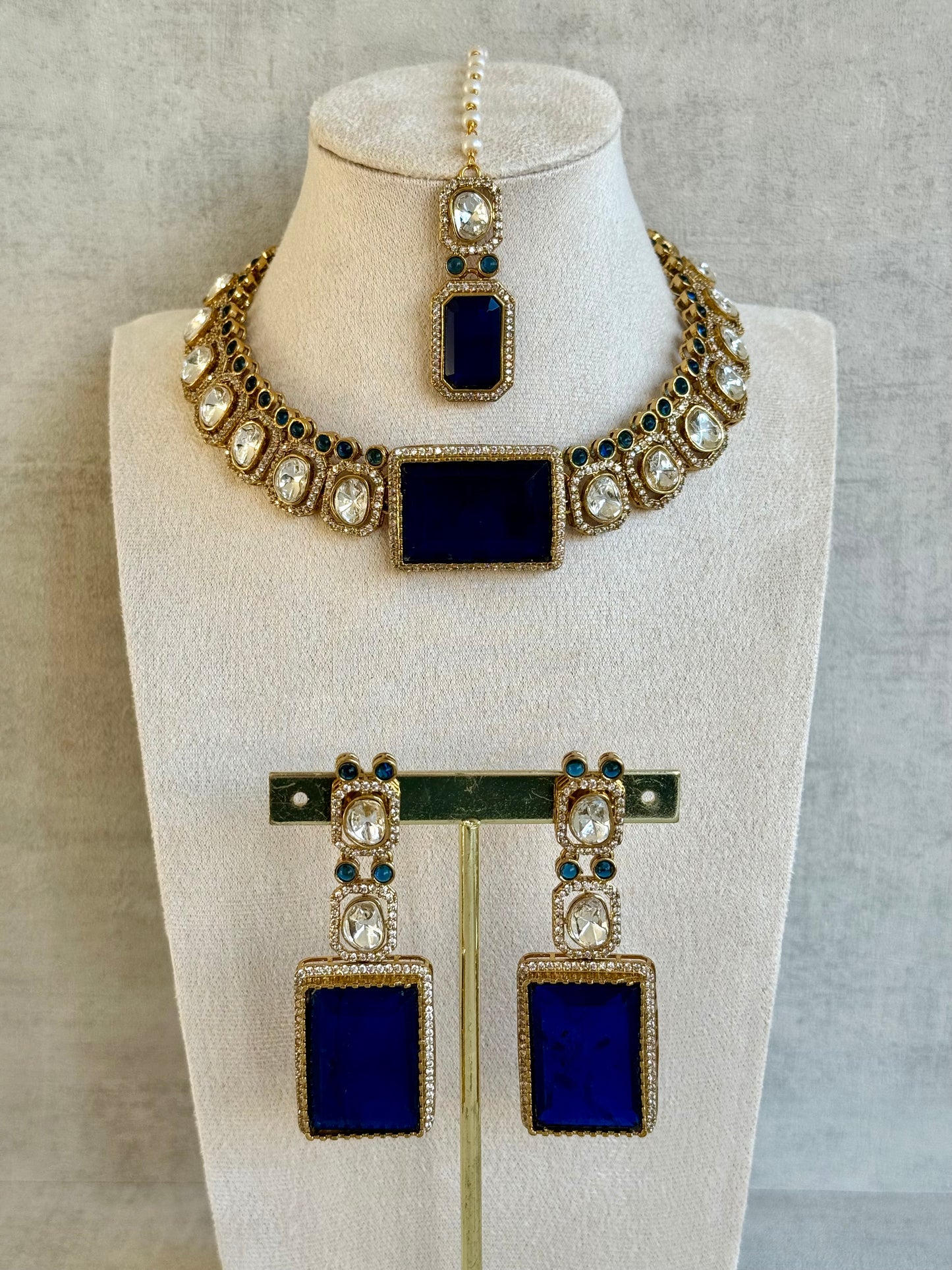 Ayura Designs Clara Set with Earrings & Tikka  – Royal Blue Stones with Moissanite and Antique Gold Finish