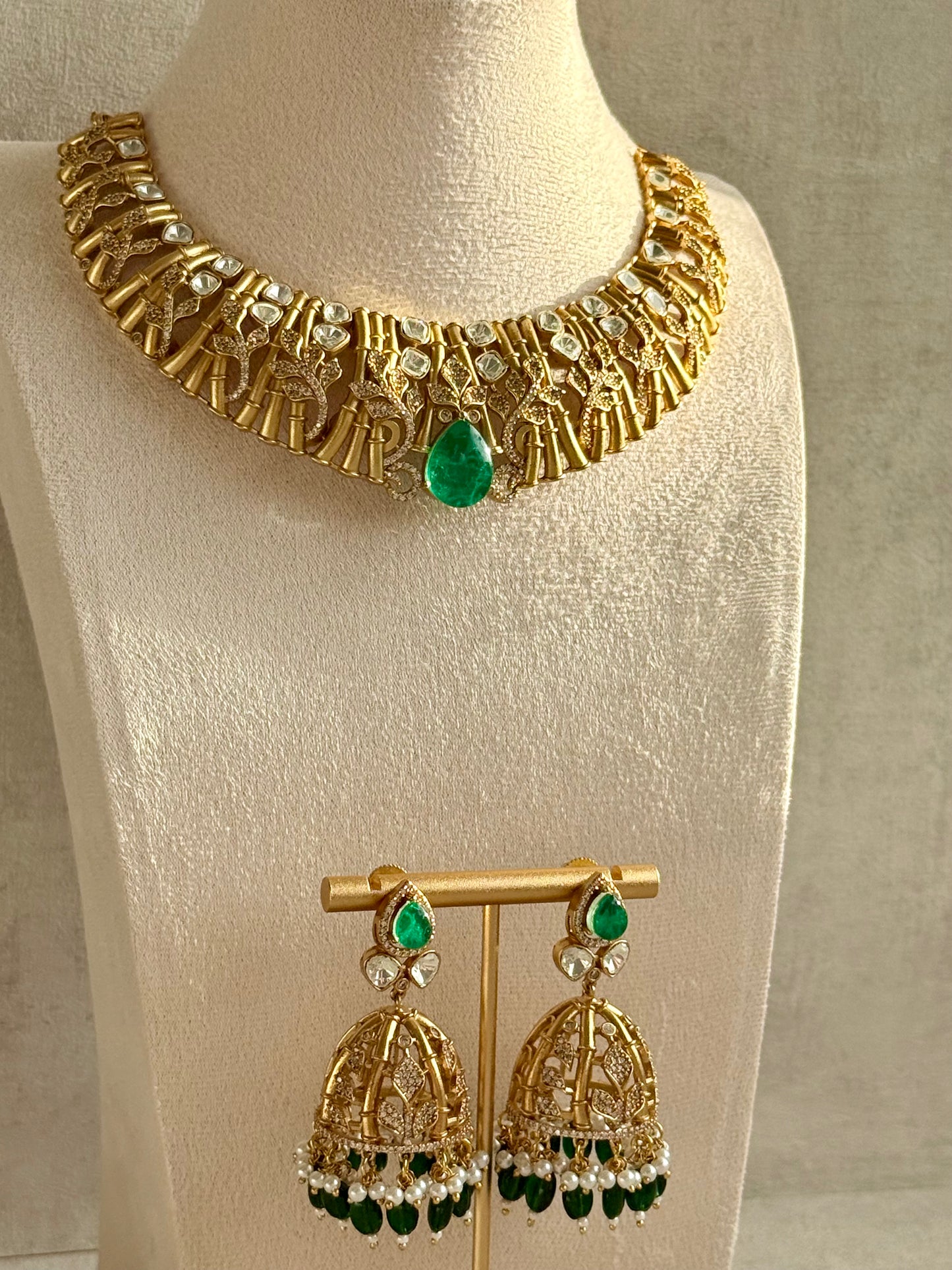 Ayura Designs Rami Collar Set with Jhumkis – Sculpted Gold Collar with Emerald Green Stone and Crystal Detailing