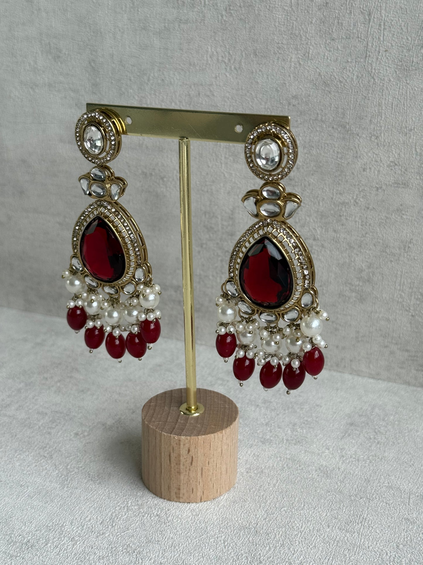 Ayura Designs Nageen Earrings – Antique Gold Jhumkis with Ruby Red Stones, Mirror-Cut Accents & Pearl Drops