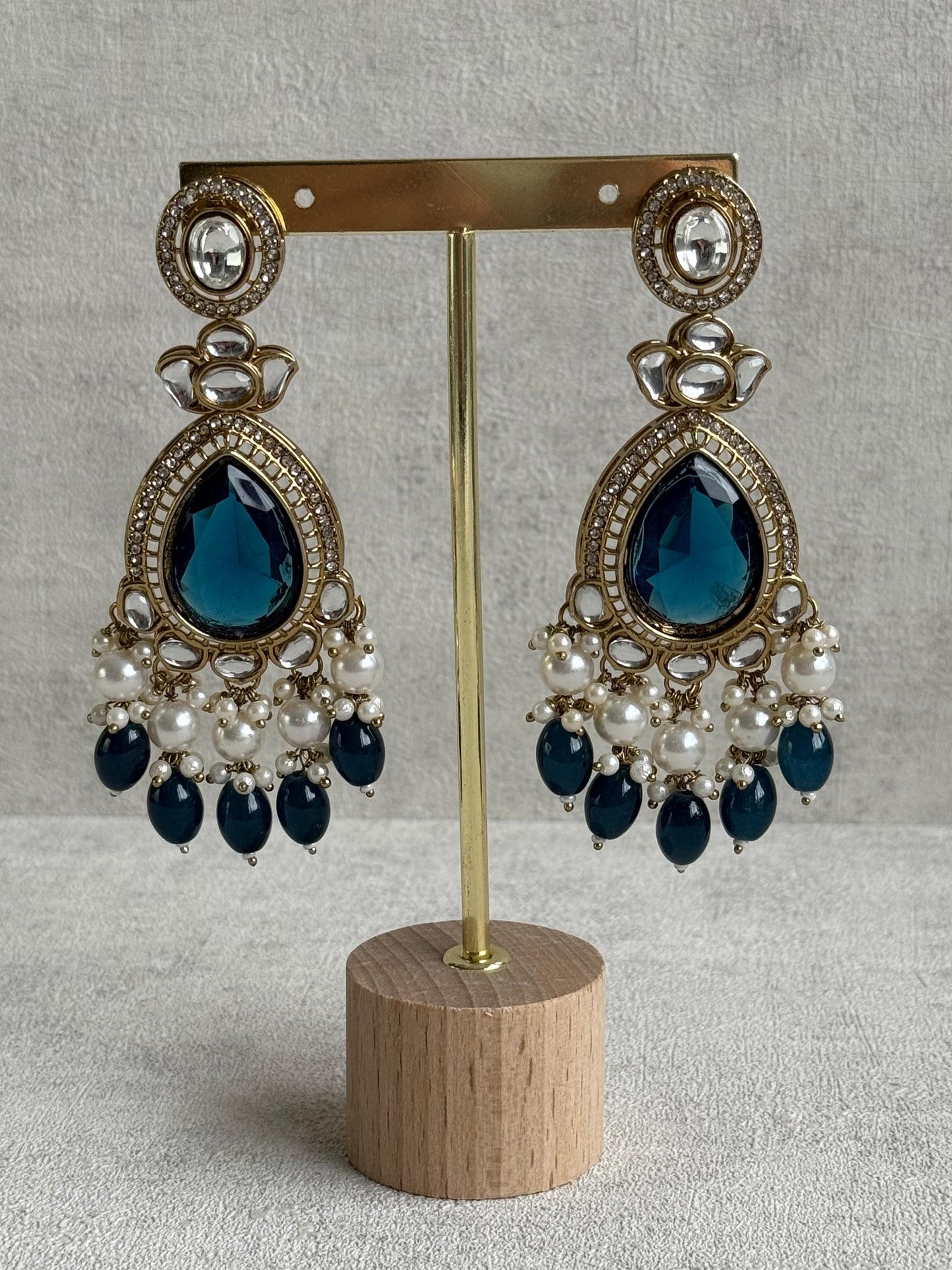 Ayura Designs Nageen Earrings – Antique Gold Jhumkis with Ink Blue Stones, Mirror-Cut Detailing & Pearl Drops