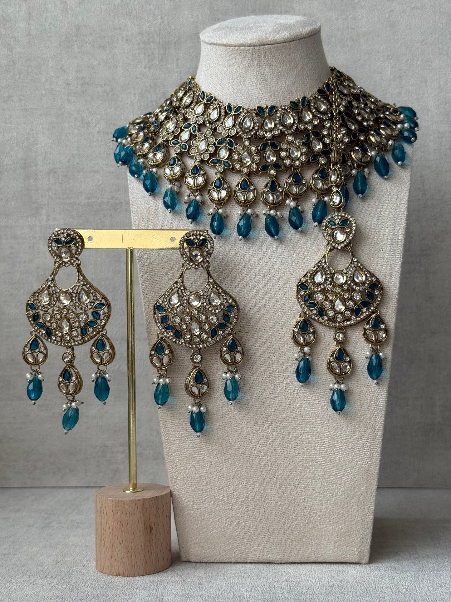 Ayura Designs Hoorain Set with Earrings – Antique Gold Finish, Mirror-Cut Stones & Peacock Blue Beads