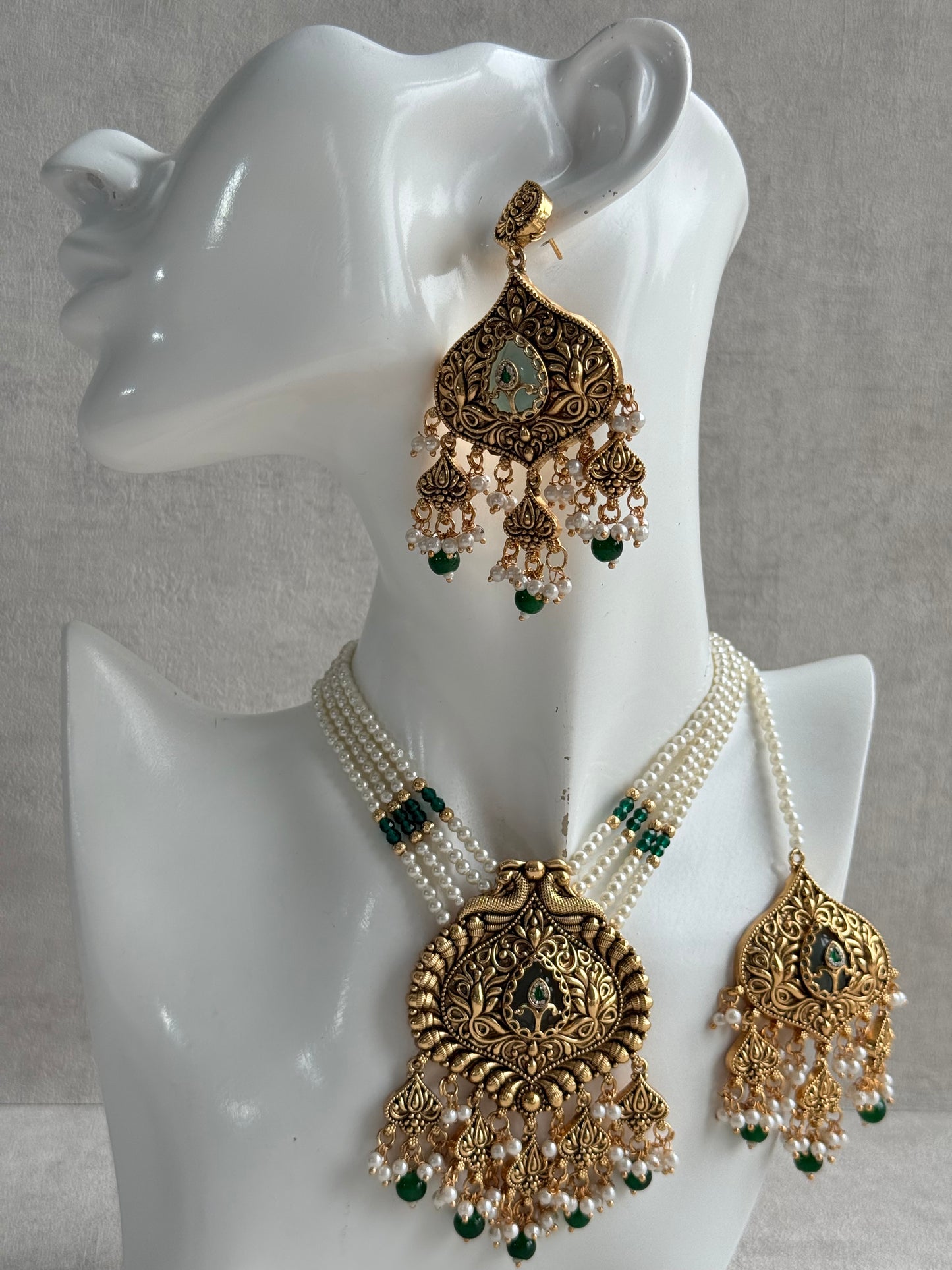 Ayura Designs Afia Necklace Set with Earrings & Tikka – Antique Gold, Emerald Green Beads, Green Centre Stone & Peacock Motifs