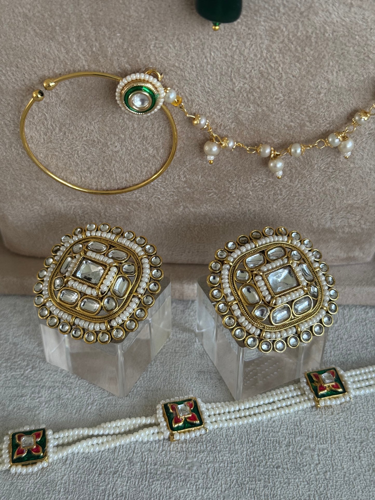 Ayura Designs Malika Bridal Set with Necklace, Jhumkis, Tikka, Nath, Ring & Sheeshphool – Jadau Kundan Craftsmanship with Mirror-Cut Polki, Emerald Green Drops, Ruby Accents & Antique Gold Finish