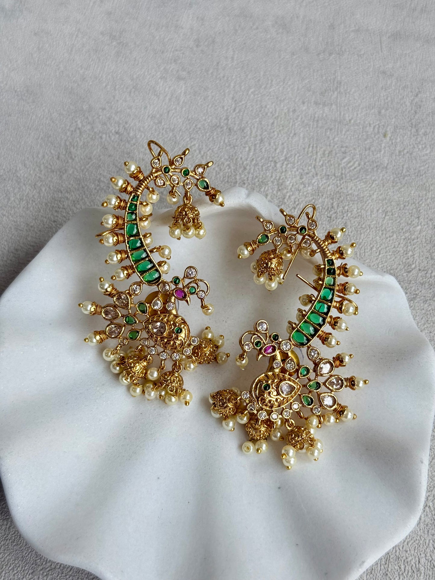 Ayura Designs Megha Half Ear Cuffs – Gold Peacock Motif with Crystal Stones, Emerald & Pink Accents and Pearl Jhumka Drops