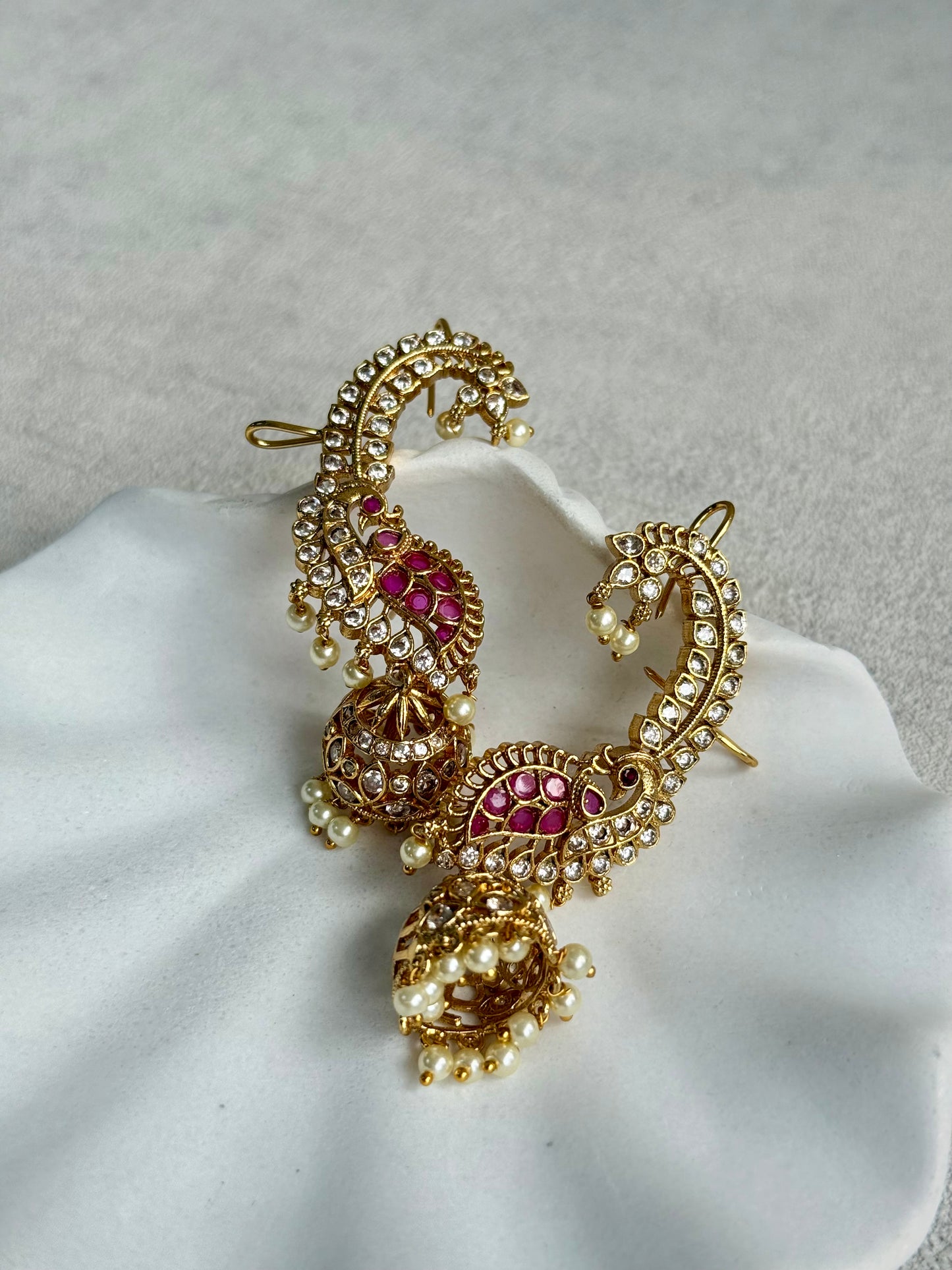 Ayura Designs Padma Earrings – Gold Half Ear Cuffs with Peacock Motif, Pink Stone Accents, Kundan Crystals & Pearl Jhumka Drops