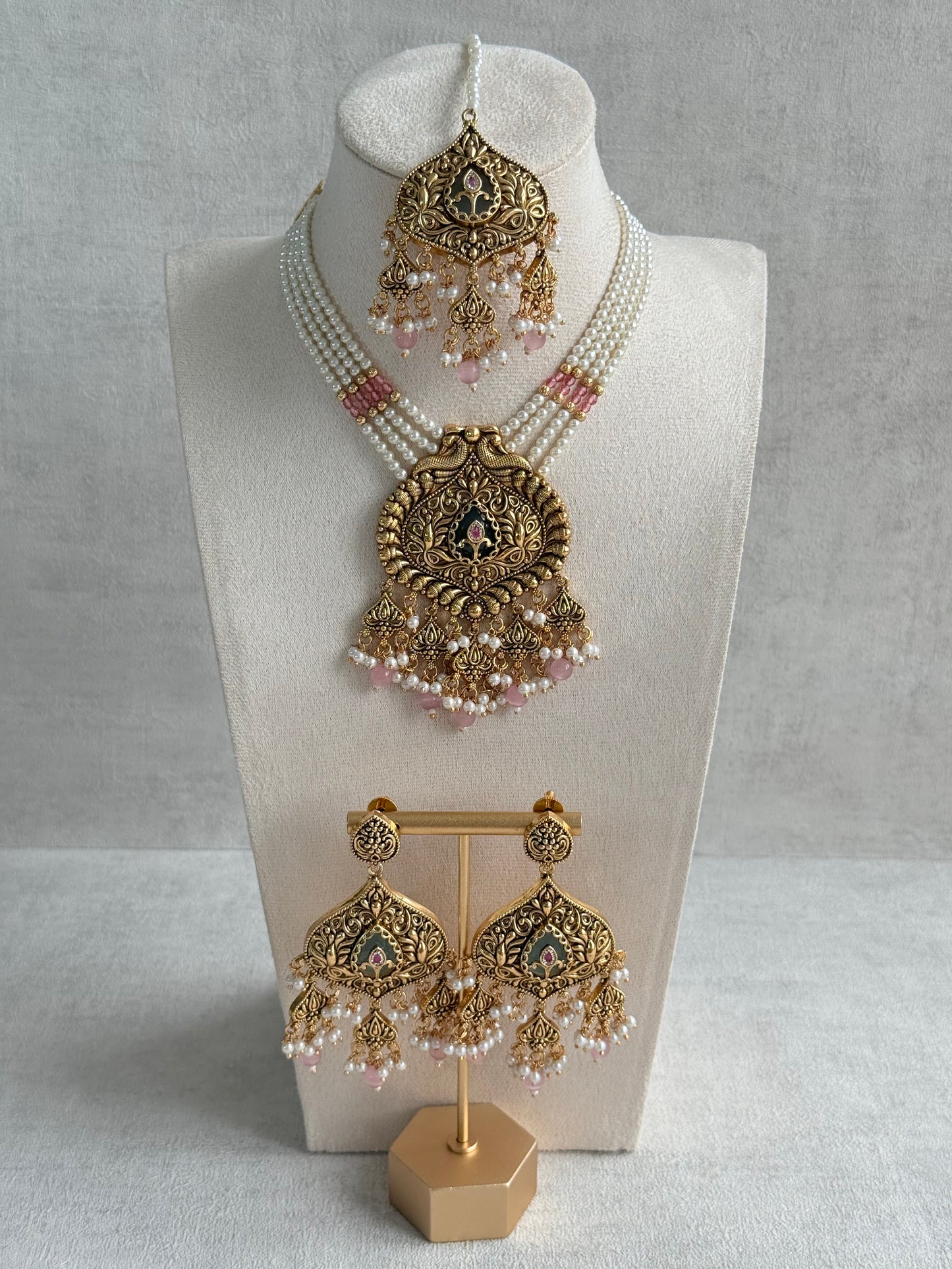 Ayura Designs Afia Necklace Set with Earrings & Tikka – Antique Gold, Blush Pink Pearls, Green Centre Stone & Peacock Motifs