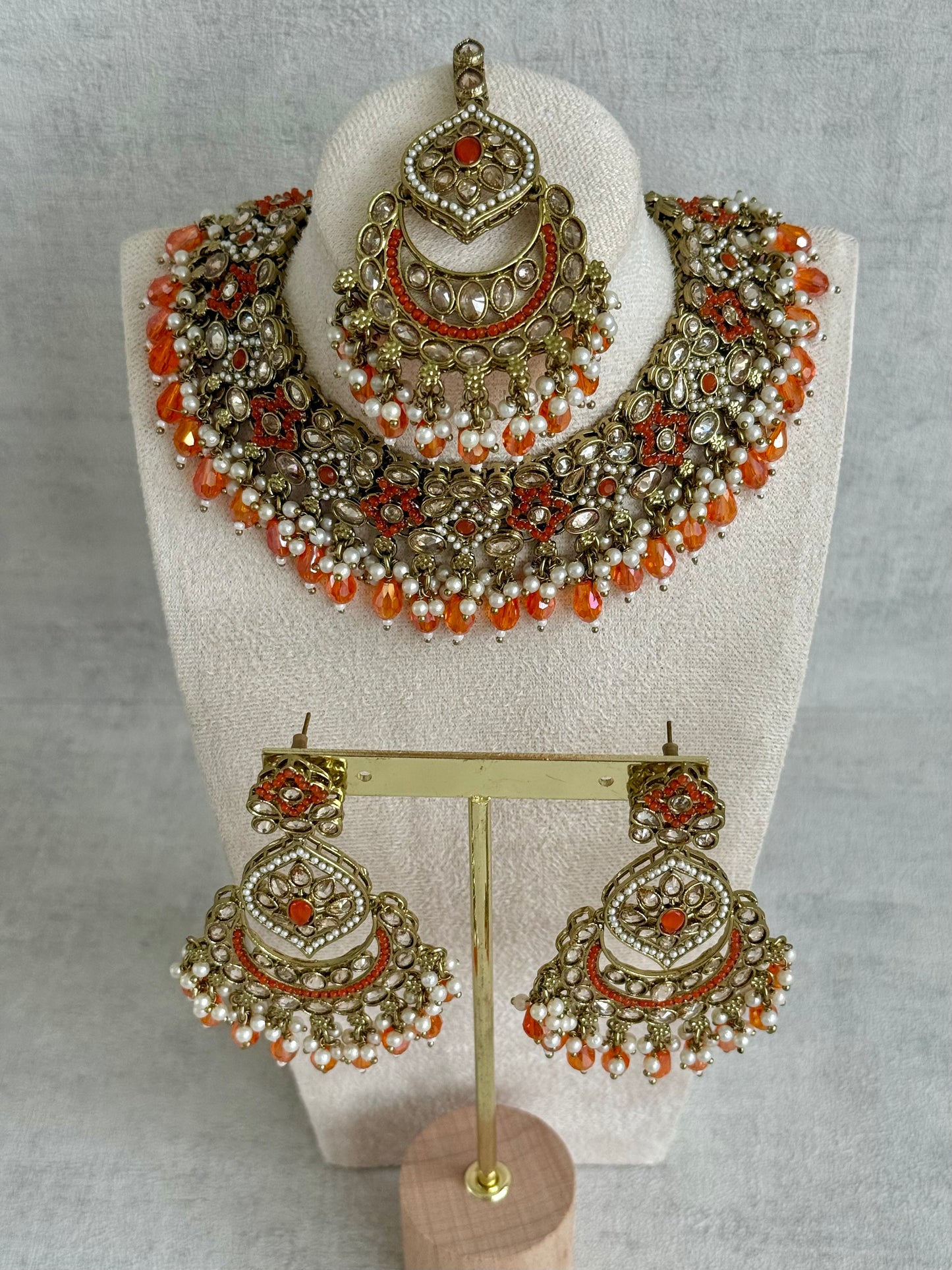 Ayura Designs Jazba Set with Necklace, Jhumkis & Tikka – Antique Gold, Mirror-Cut Stones, Pearl Detailing & Fiery Orange Beads