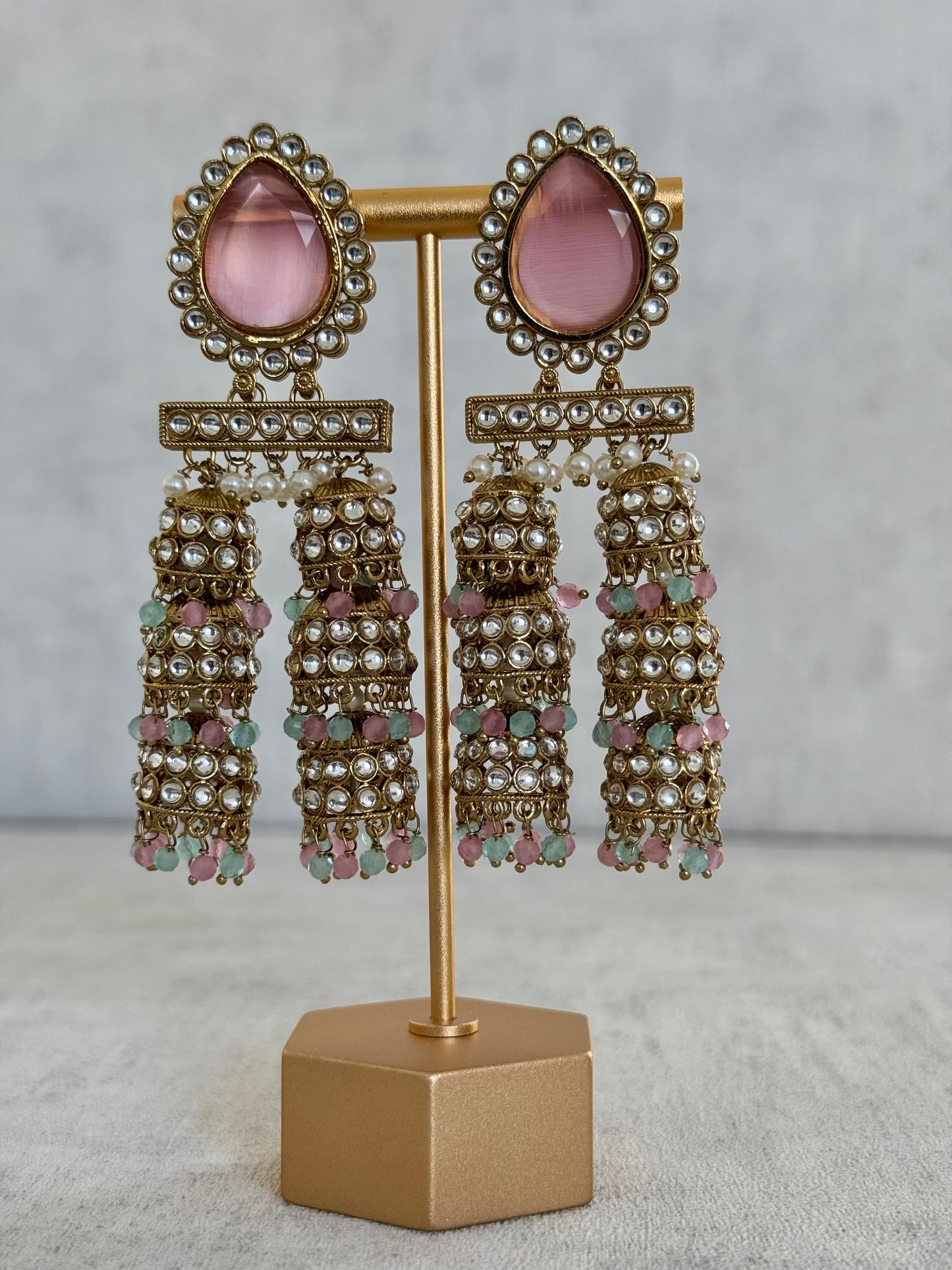 Ayura Designs Kyra Earrings – Pink & Gold Jhumkas with Kundan, Pearl, and Pastel Green & Pink Bead Detailing