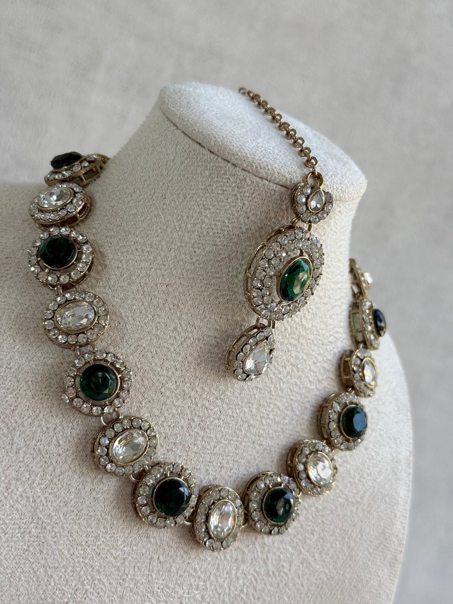 Ayura Designs Eira Necklace Set with Earrings & Tikka – Emerald Green & Crystal Stones with Antique Gold Finish