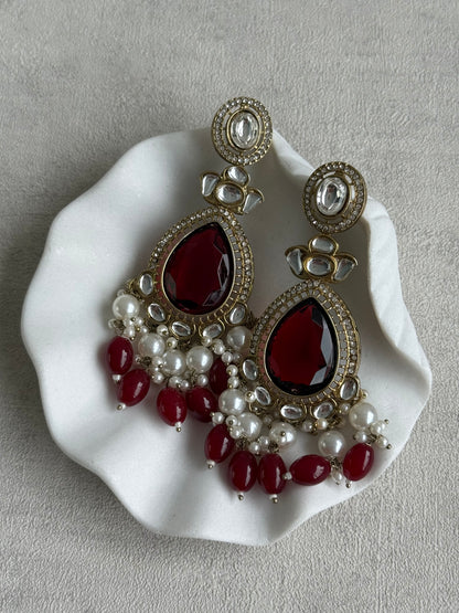 Ayura Designs Nageen Earrings – Antique Gold Jhumkis with Ruby Red Stones, Mirror-Cut Accents & Pearl Drops