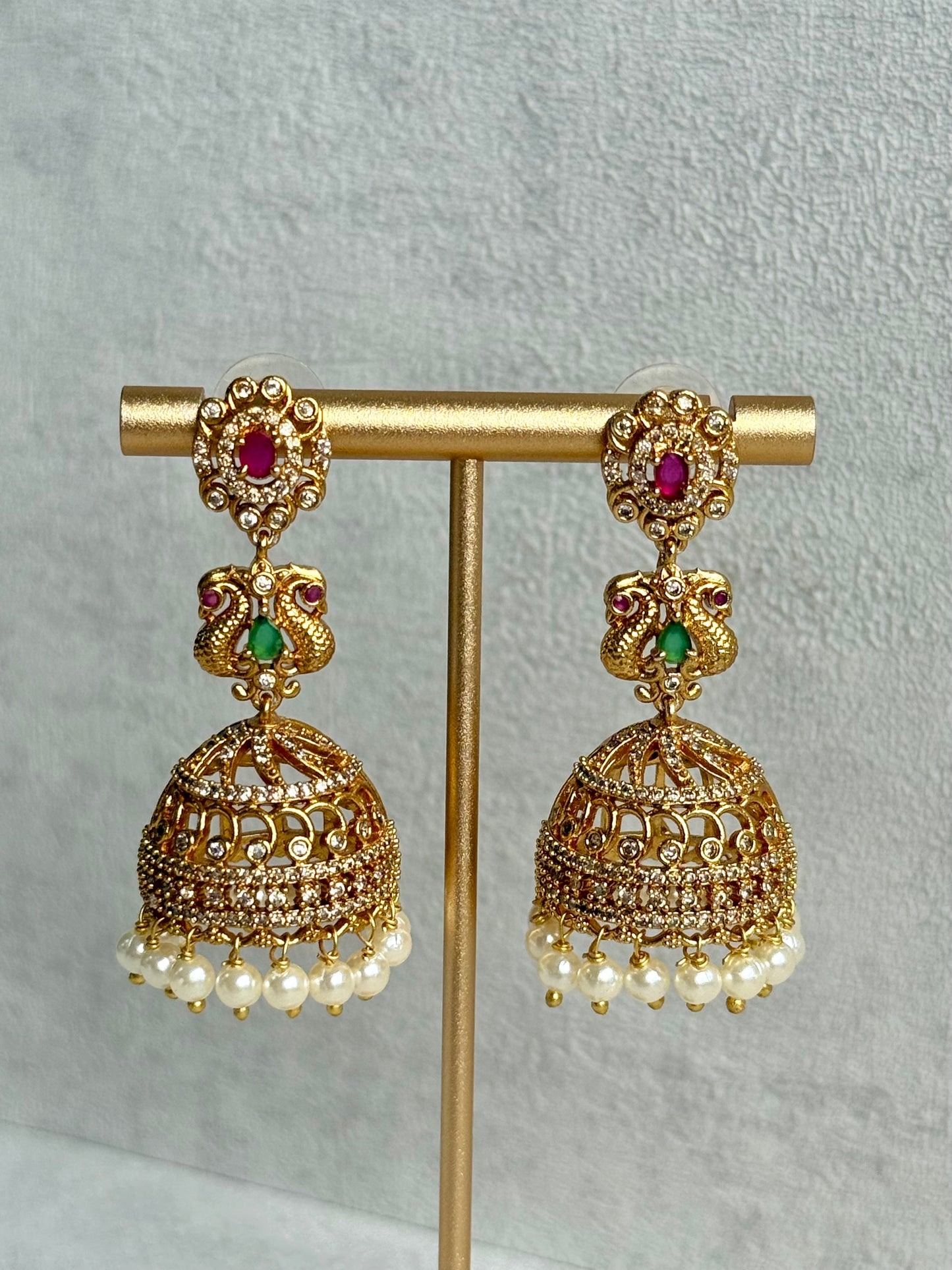 Ayura Designs Darya Jhumkis – Gold Peacock Motif Jhumkis with Ruby Pink, Emerald Green and Pearl Detailing