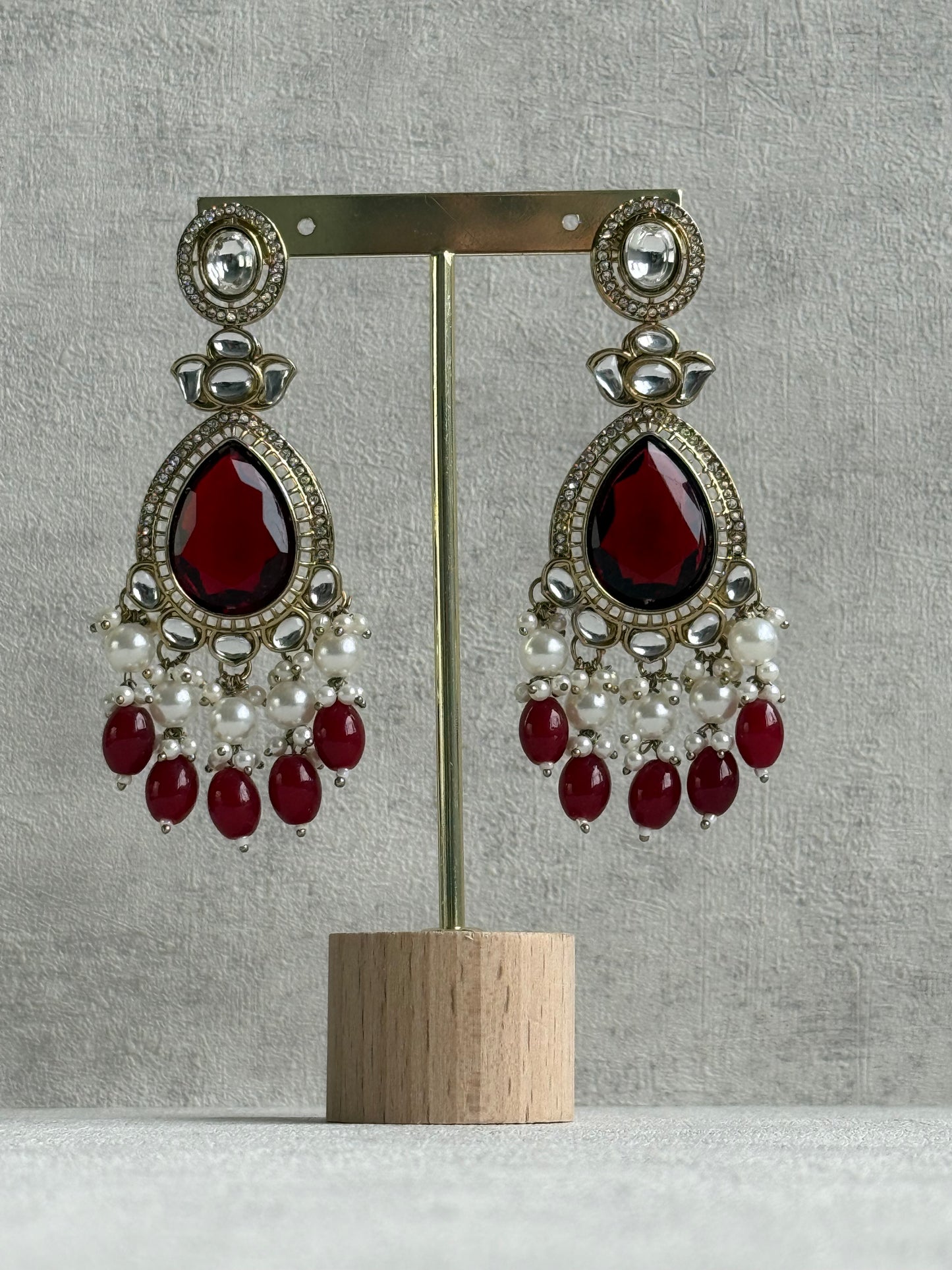 Ayura Designs Nageen Earrings – Antique Gold Jhumkis with Ruby Red Stones, Mirror-Cut Accents & Pearl Drops