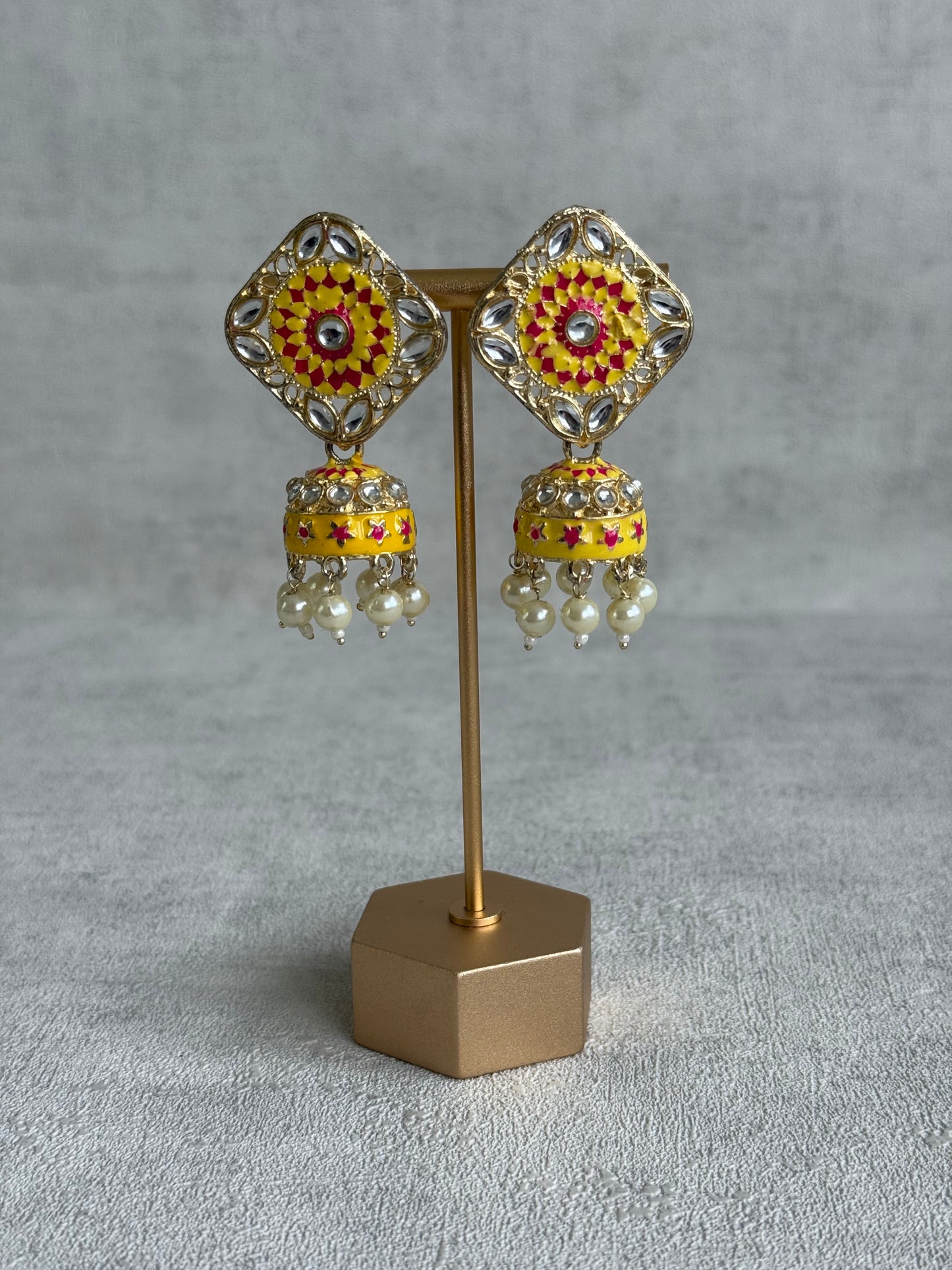 Ayura Designs Rangoli Jhumkis – Marigold Yellow & Hot Pink Meenakari with Pearl Drops in Antique Gold Finish