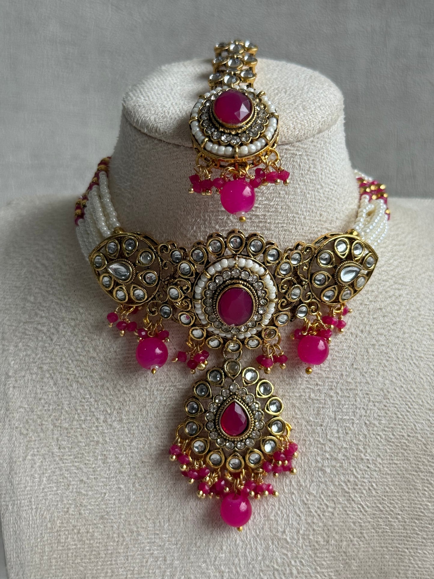 Ayura Designs Muskaan Set – Choker, Jhumkis & Tikka with Hot Pink Beads, Kundan Stones & Antique Gold Finish