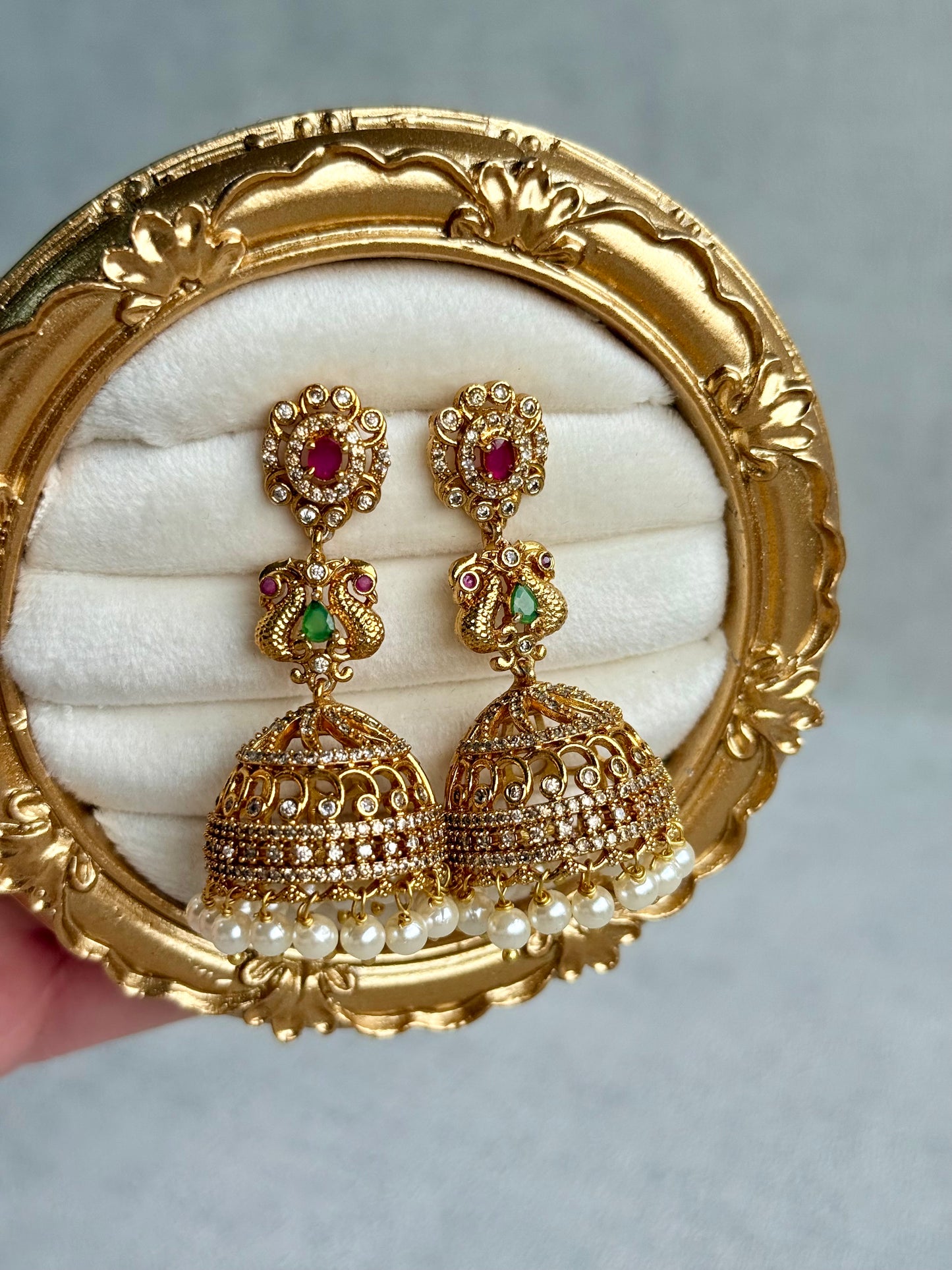 Ayura Designs Darya Jhumkis – Gold Peacock Motif Jhumkis with Ruby Pink, Emerald Green and Pearl Detailing