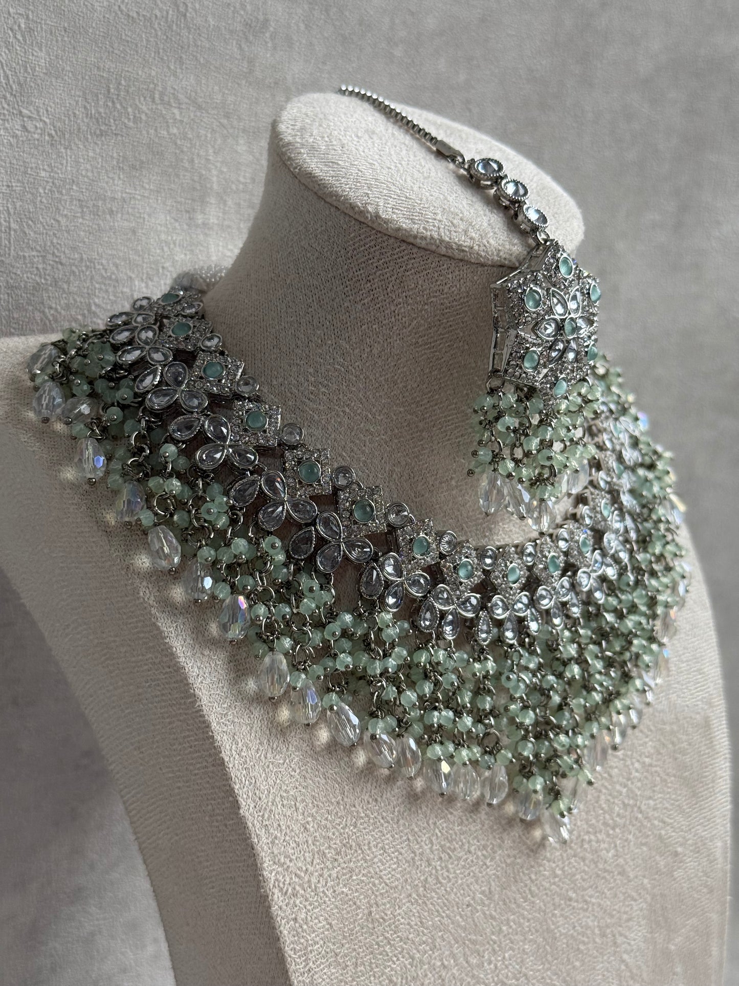 Ayura Designs Rayna Set – Necklace, Jhumkis & Tikka with Mint Green Beads, Mirror-Cut Stones & Silver Finish