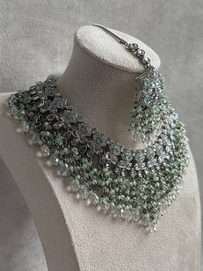 Ayura Designs Rayna Set – Necklace, Jhumkis & Tikka with Mint Green Beads, Mirror-Cut Stones & Silver Finish