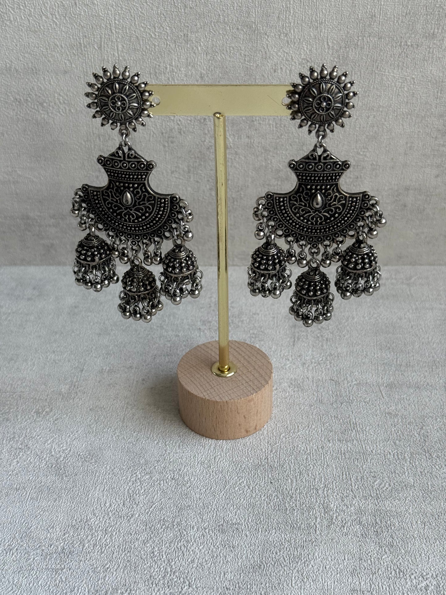 Ayura Designs Mahfar Earrings – Oxidised Silver Jhumkas with Sunburst Tops & Triple Dome Drops