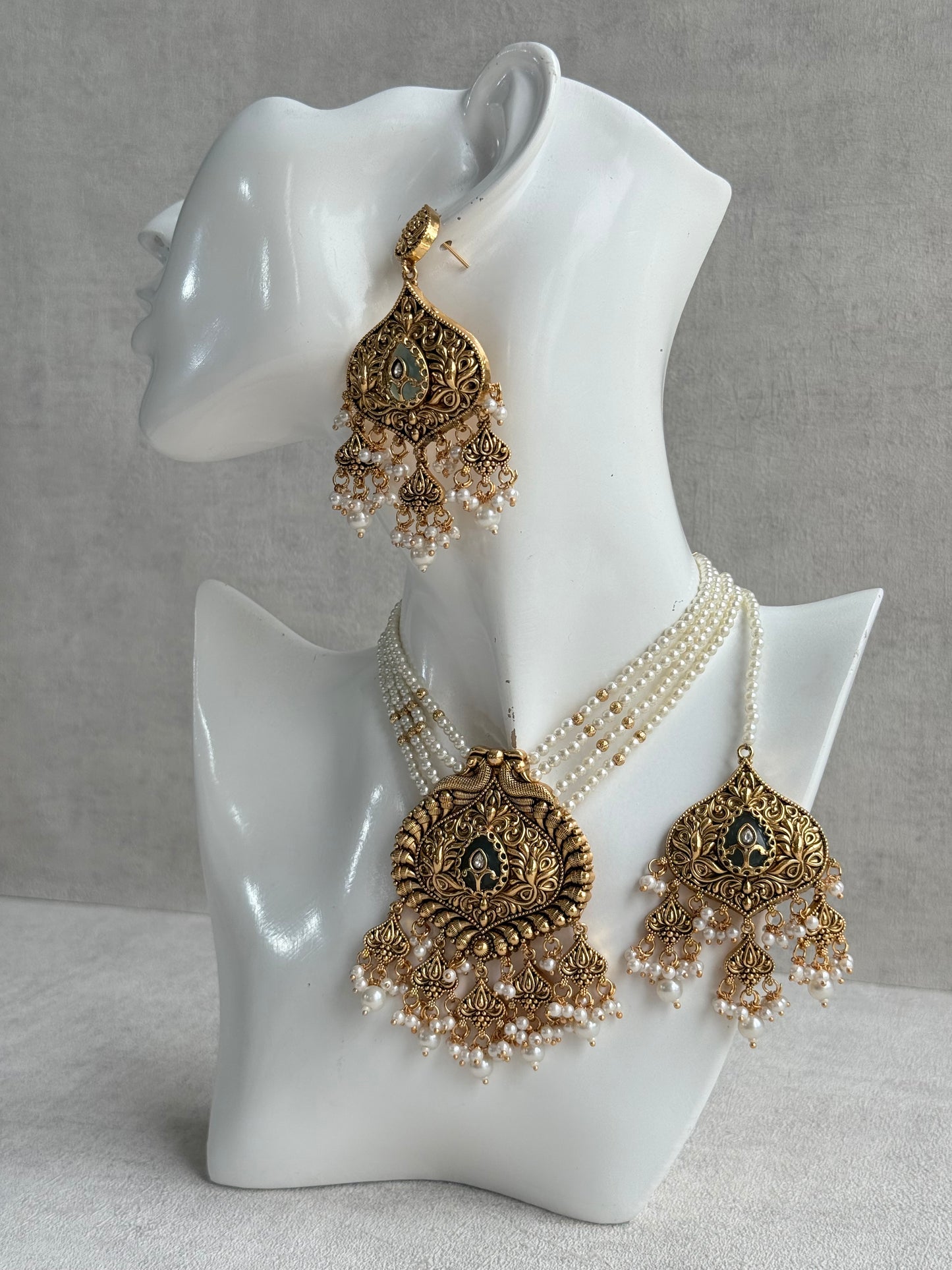 Ayura Designs Afia Necklace Set with Earrings & Tikka – Antique Gold, Ivory Pearls, Green Centre Stone & Peacock Motifs
