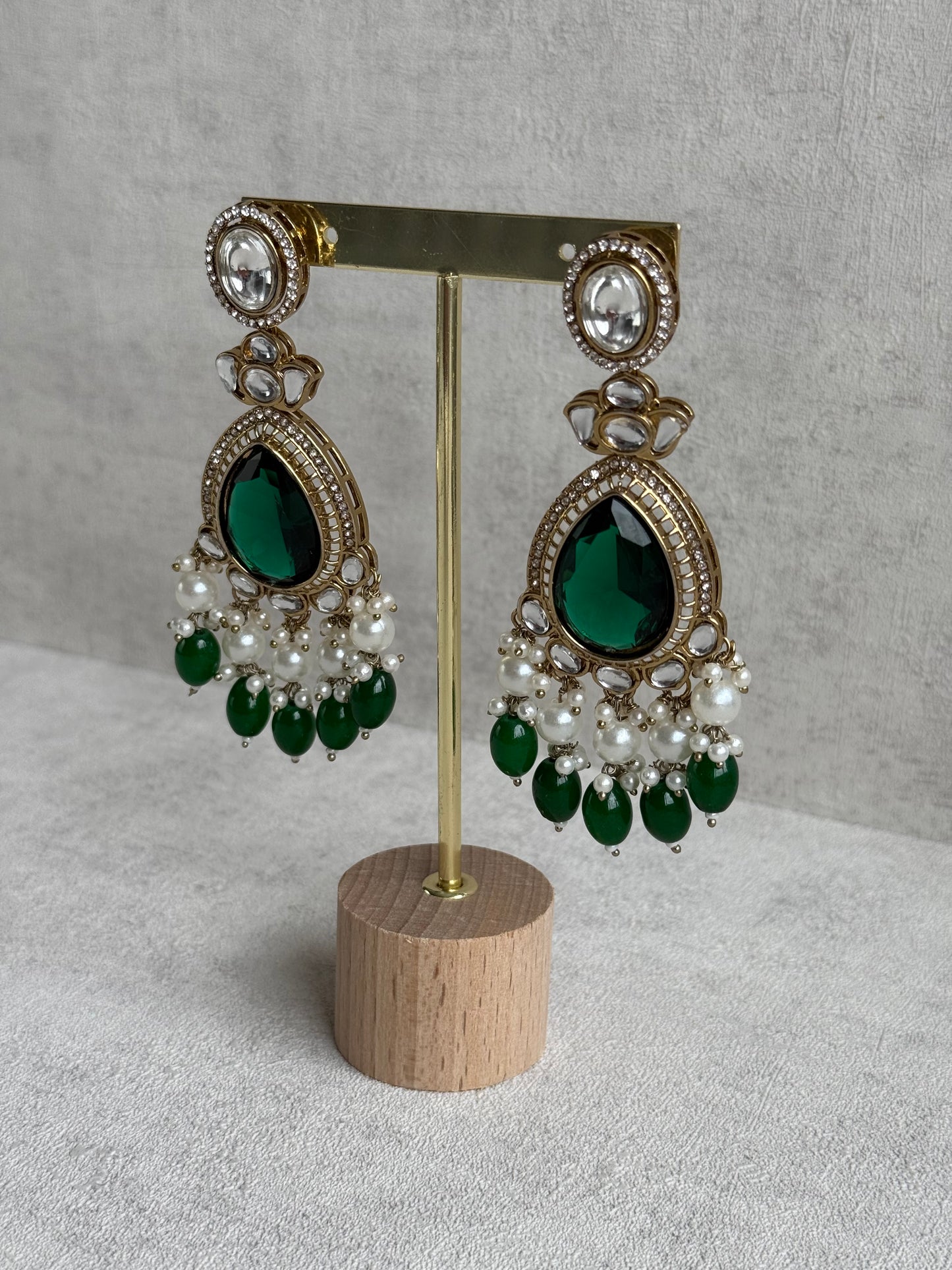 Ayura Designs Nageen Earrings – Antique Gold Jhumkis with Emerald Green Stones, Mirror-Cut Accents & Pearl Drops