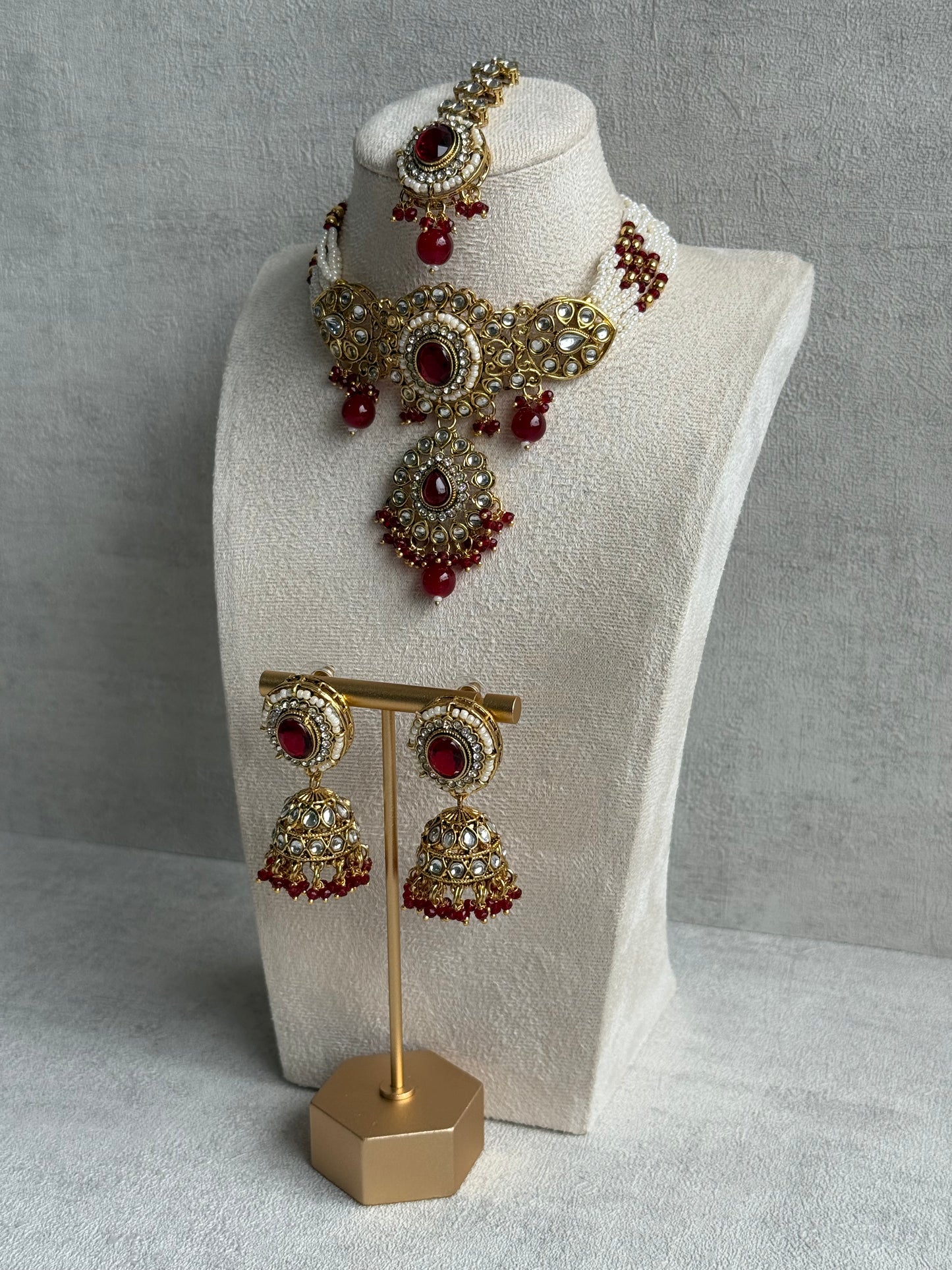 Ayura Designs Muskaan Set – Choker, Jhumkis & Tikka with Ruby Red Beads, Kundan Stones & Antique Gold Finish