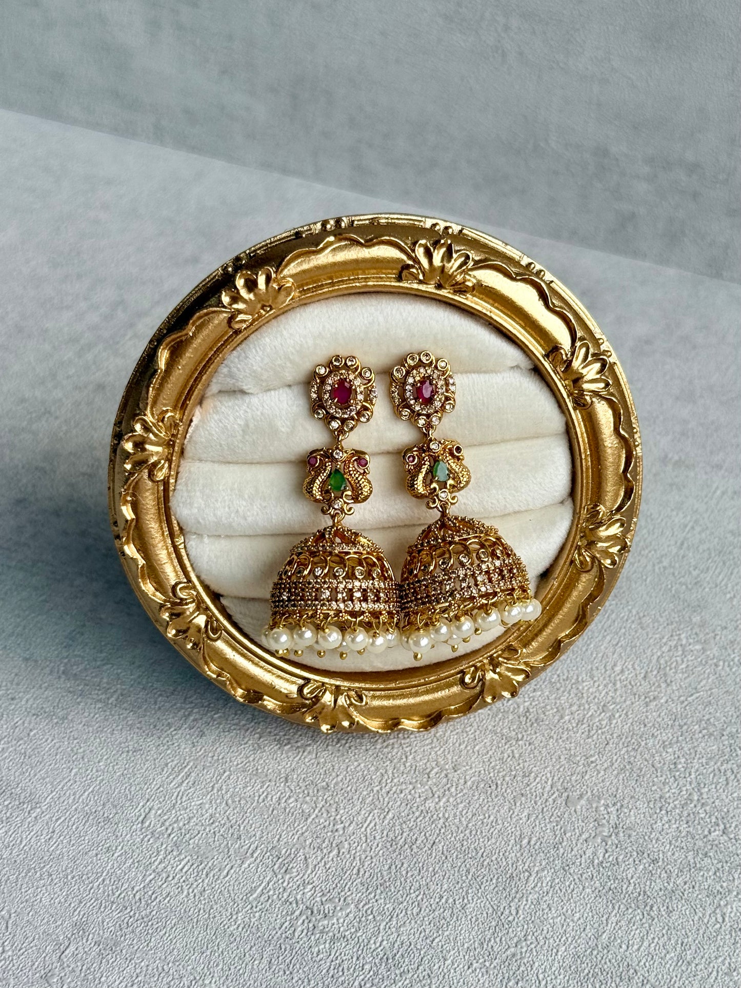 Ayura Designs Darya Jhumkis – Gold Peacock Motif Jhumkis with Ruby Pink, Emerald Green and Pearl Detailing