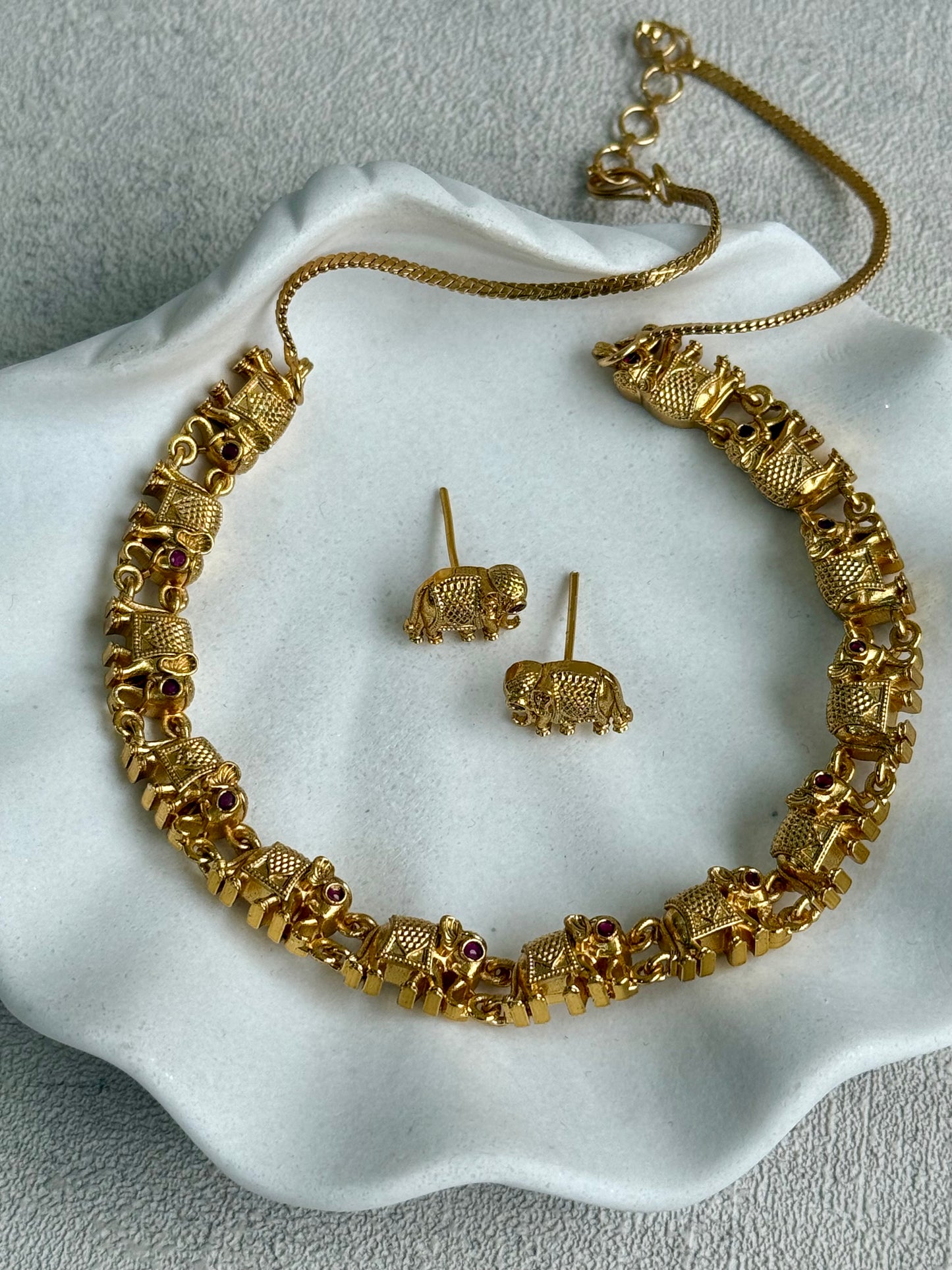 Ayura Designs Veda Set – Antique Gold Necklace & Stud Earrings with Elephant Motifs and Pink Stone Detailing