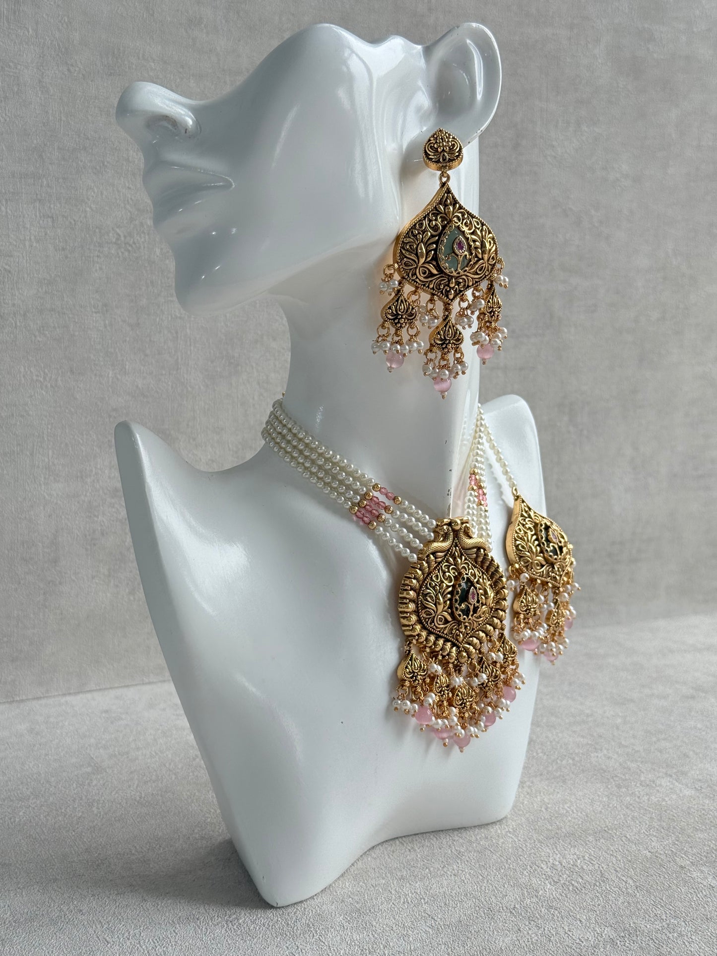 Ayura Designs Afia Necklace Set with Earrings & Tikka – Antique Gold, Blush Pink Pearls, Green Centre Stone & Peacock Motifs