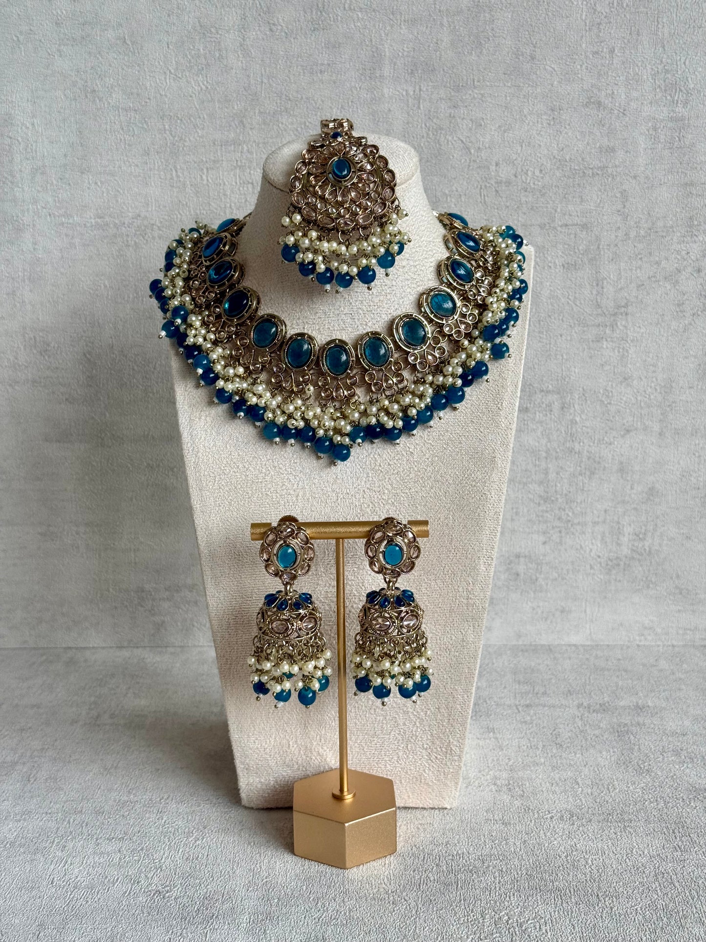 Ayura Designs Zubi Set with Jhumkis & Tikka – Deep Blue Stones, Pearl Detailing & Antique Gold Finish