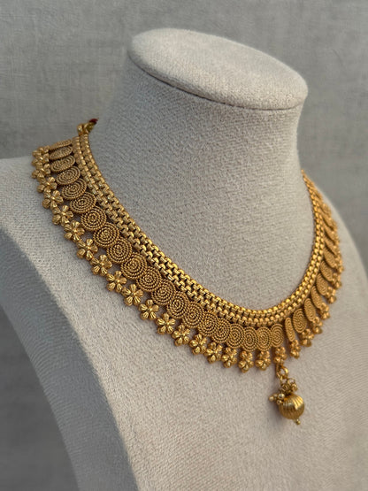 Ayura Designs Purna Set with Necklace & Earrings – Antique Gold Finish, Floral Motifs & Textured Pendant Detail