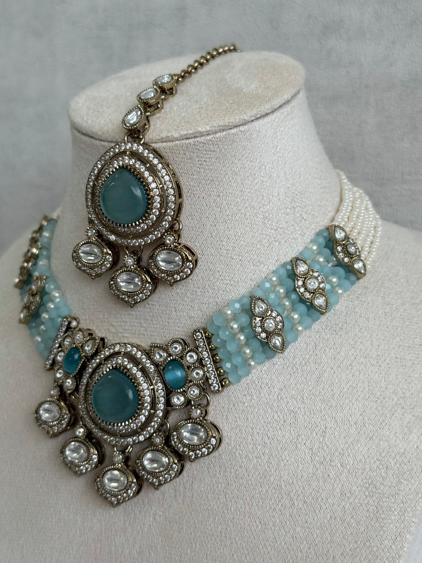 Ayura Designs Rahi Necklace Set with Earrings & Tikka – Aqua Blue Stones with Mirror-Cut Detailing & Pearl Strands
