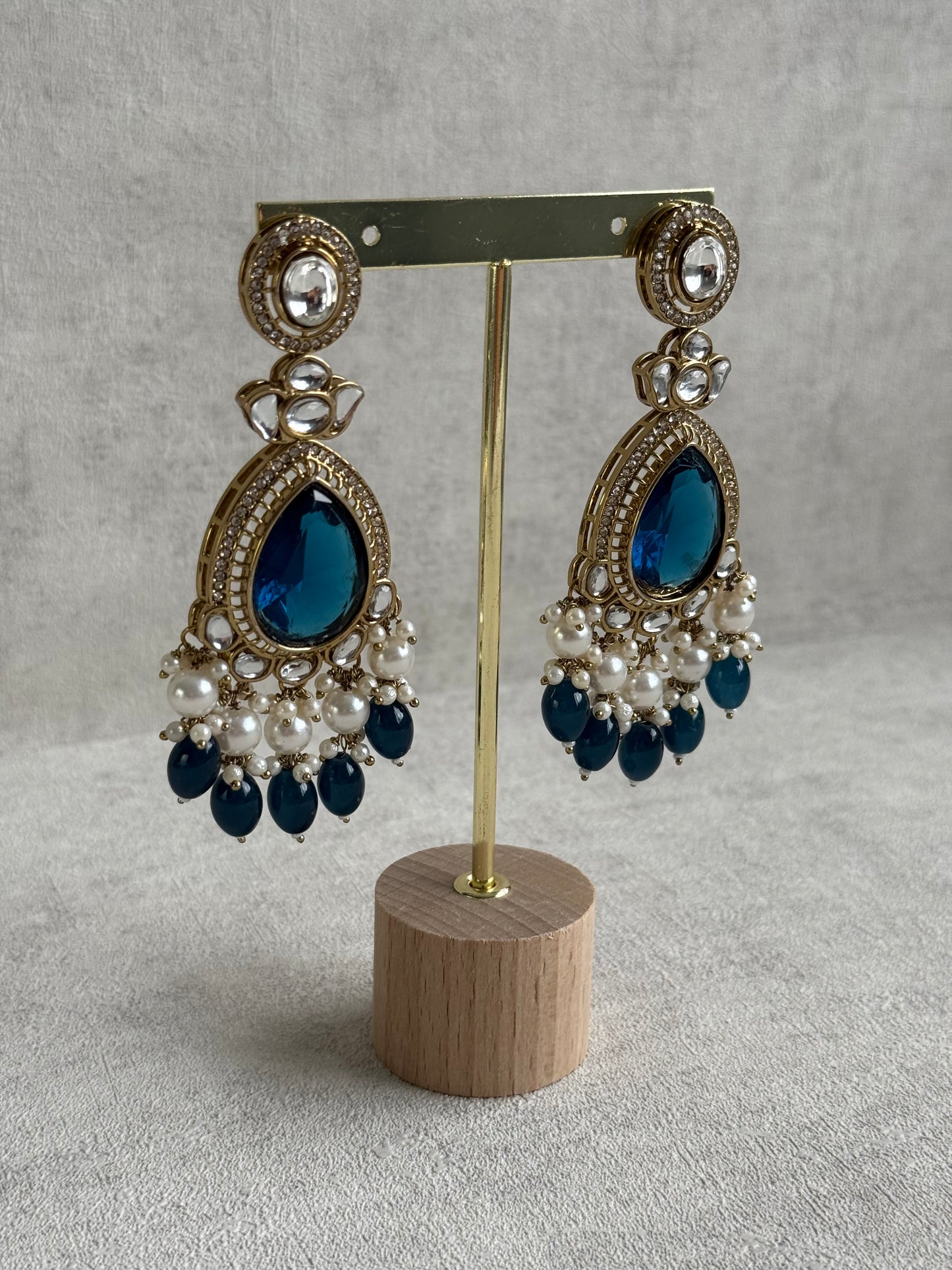 Ayura Designs Nageen Earrings – Antique Gold Jhumkis with Ink Blue Stones, Mirror-Cut Detailing & Pearl Drops