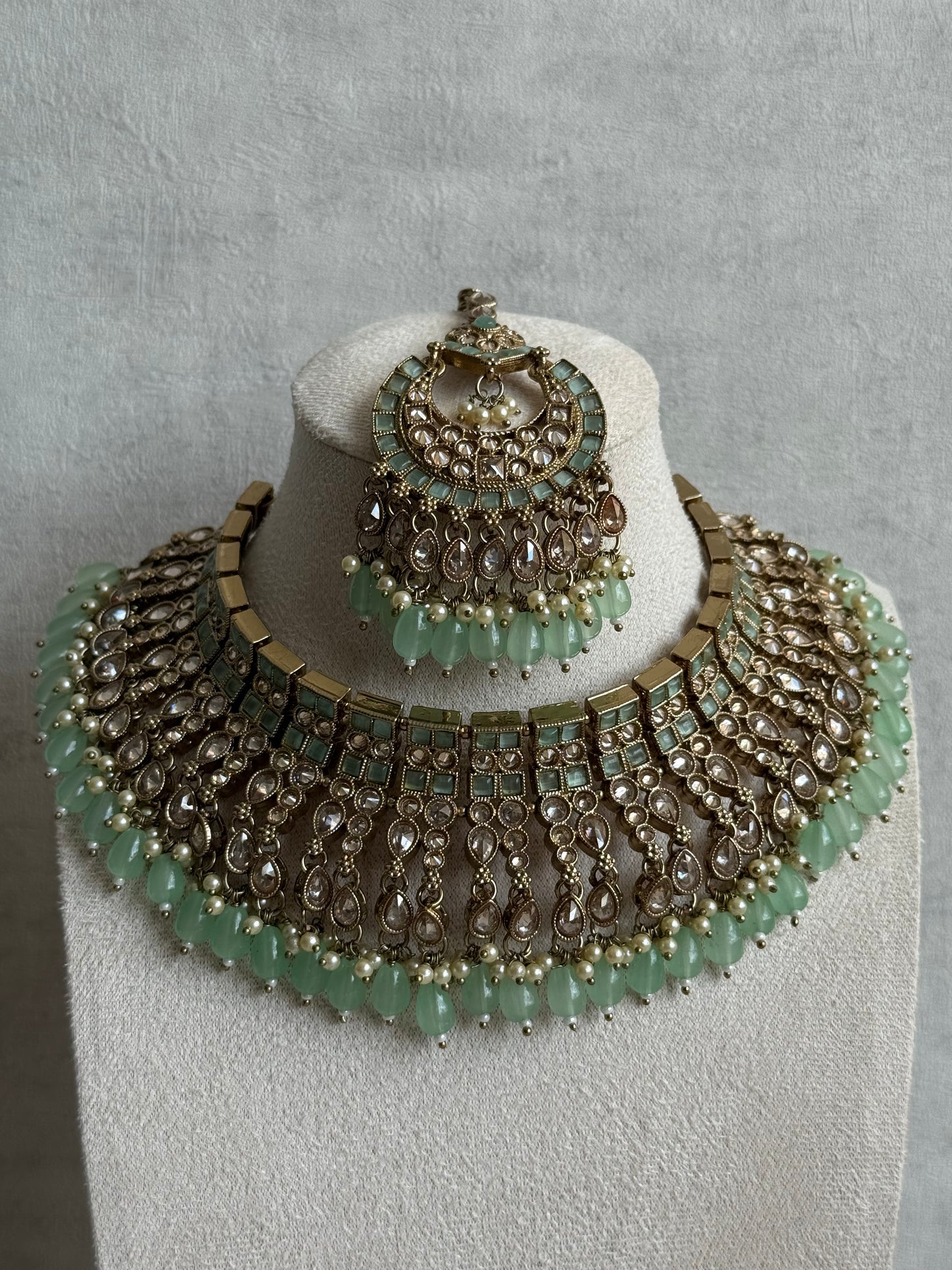 Ayura Designs Sajda Bridal Set with Necklace, Earrings, Tikka & Passa – Pistachio Green Beads, Kundan & Mirror-Cut Detailing