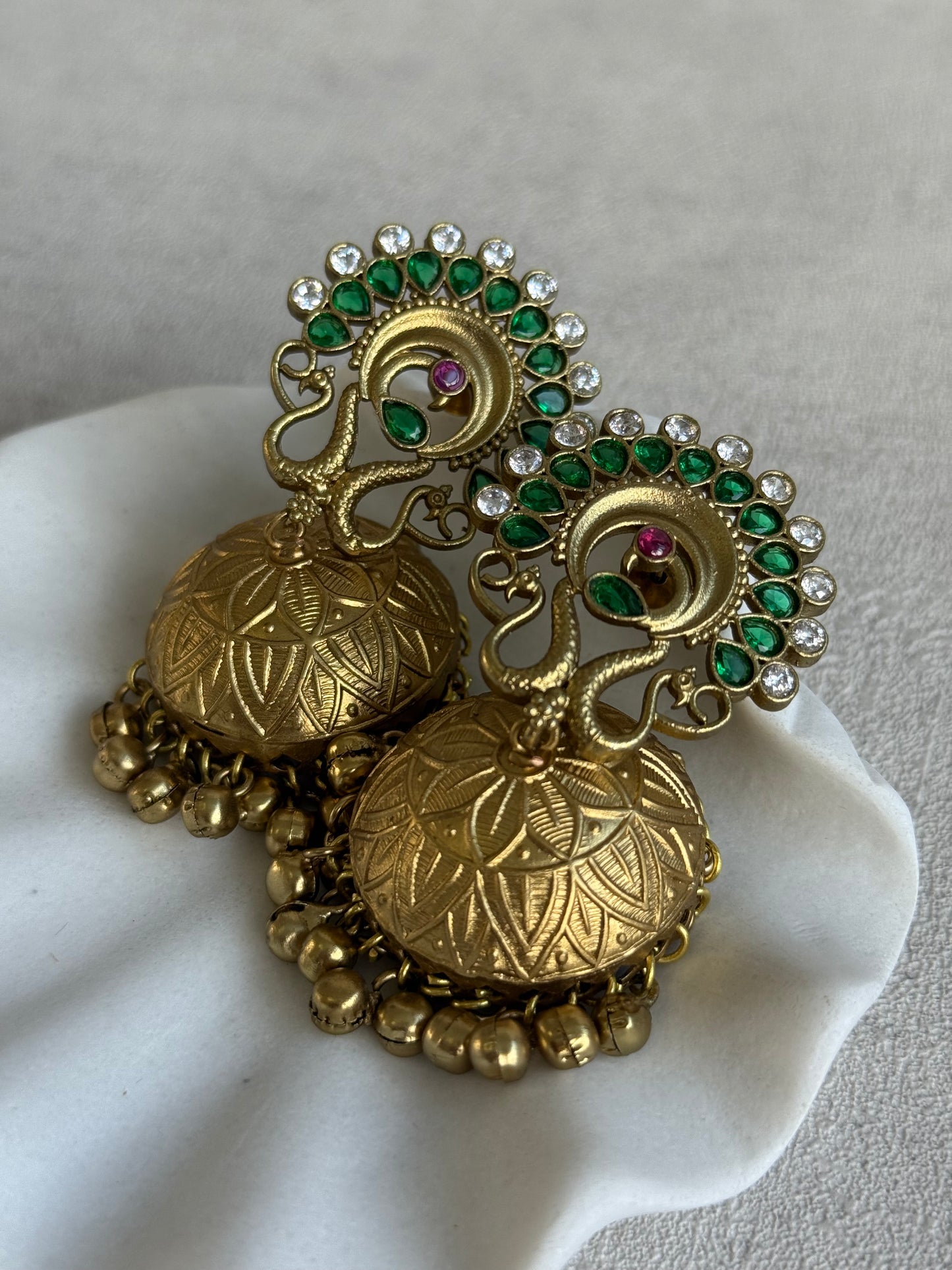 Ayura Designs Moraya Jhumkis – Emerald Green Peacock Motif with Antique Gold Detailing