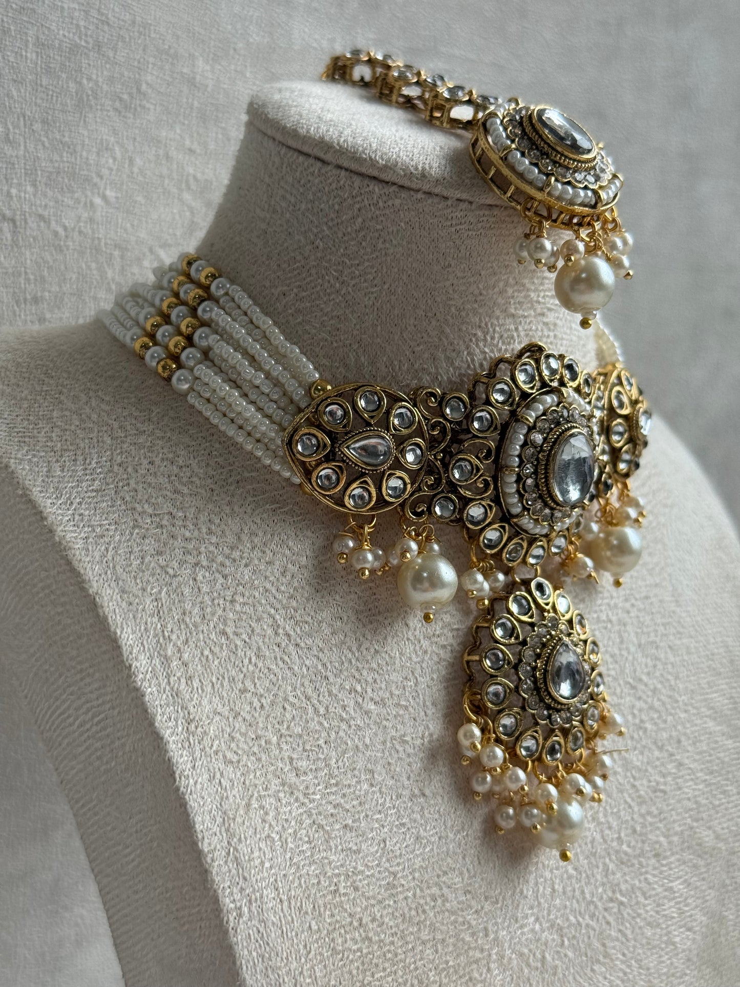 Ayura Designs Muskaan Set – Choker, Jhumkis & Tikka with Ivory Pearls, Mirror-Cut Kundan Stones & Antique Gold Finish