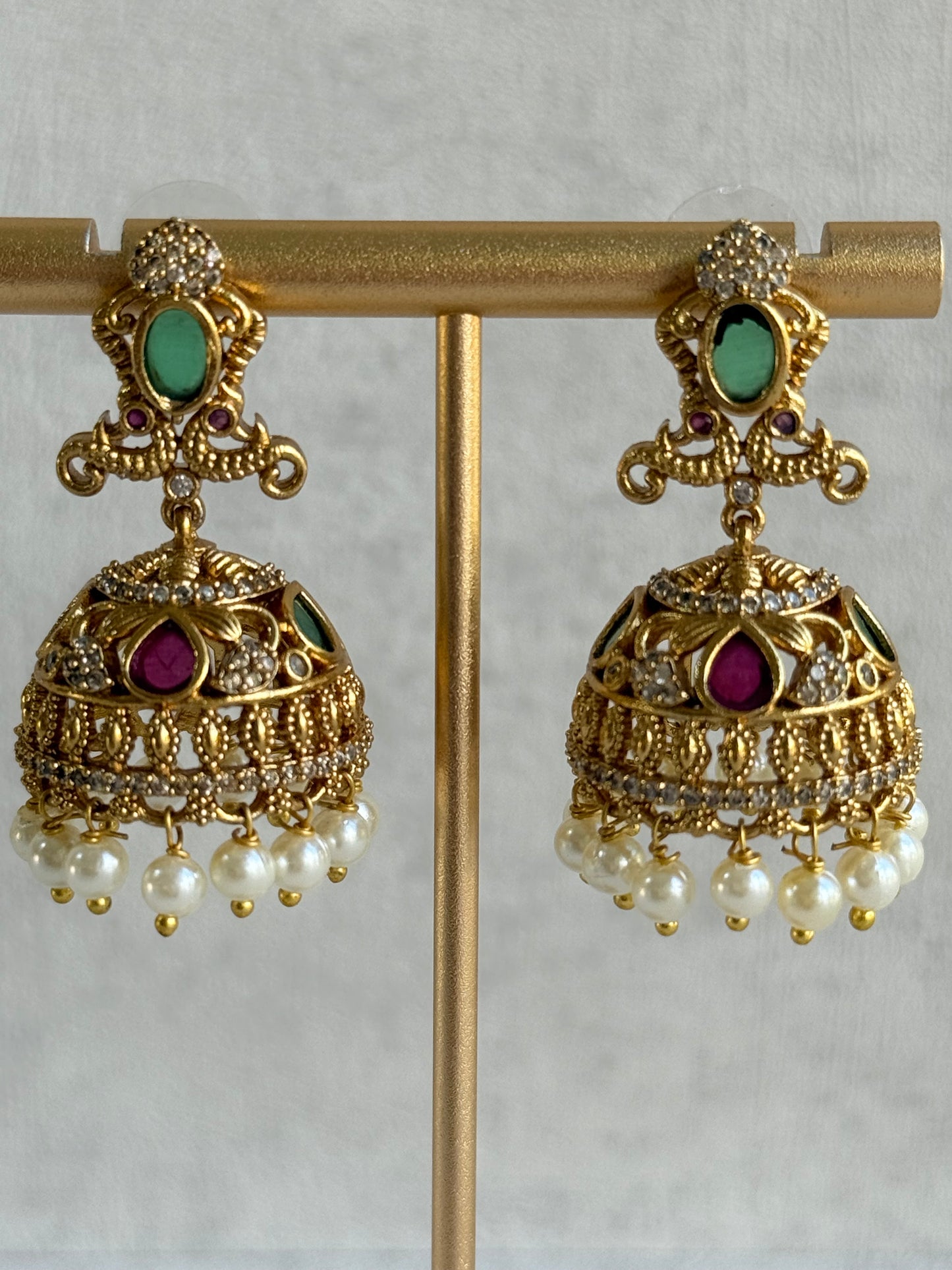 Ayura Designs Ehla Jhumkis – Gold Peacock Design with Green & Ruby Pink Stones, Crystals & Pearl Drops