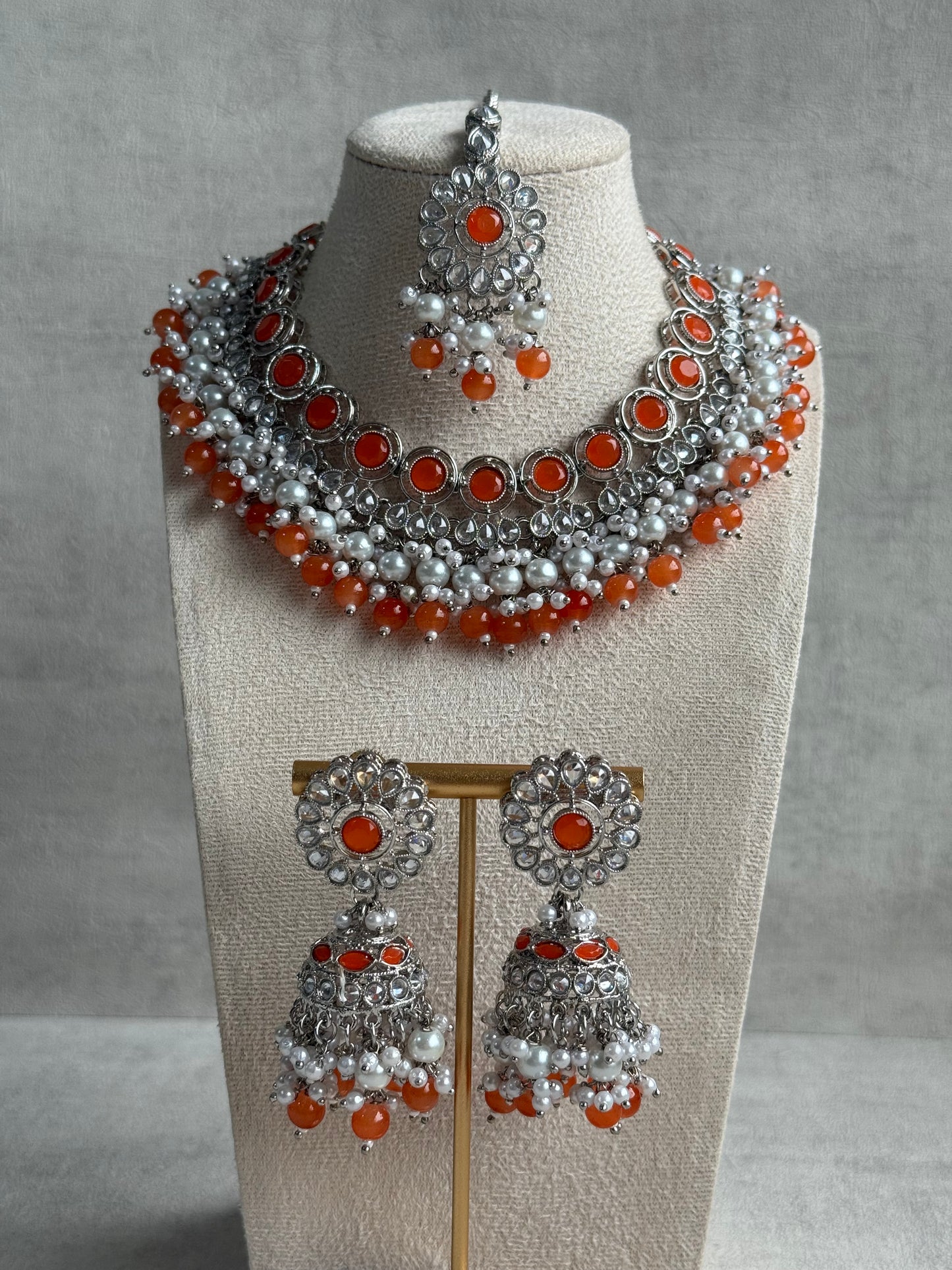 Ayura Designs Barira Set – Necklace, Jhumkis & Tikka with Orange Stones, Pearls & Antique Silver Finish