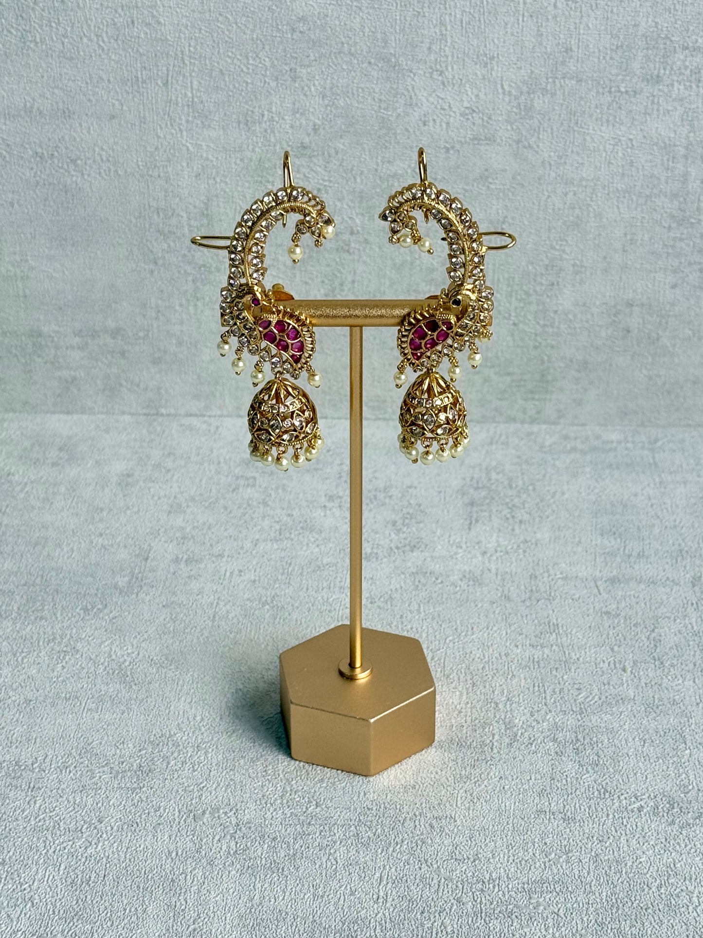 Ayura Designs Padma Earrings – Gold Half Ear Cuffs with Peacock Motif, Pink Stone Accents, Kundan Crystals & Pearl Jhumka Drops