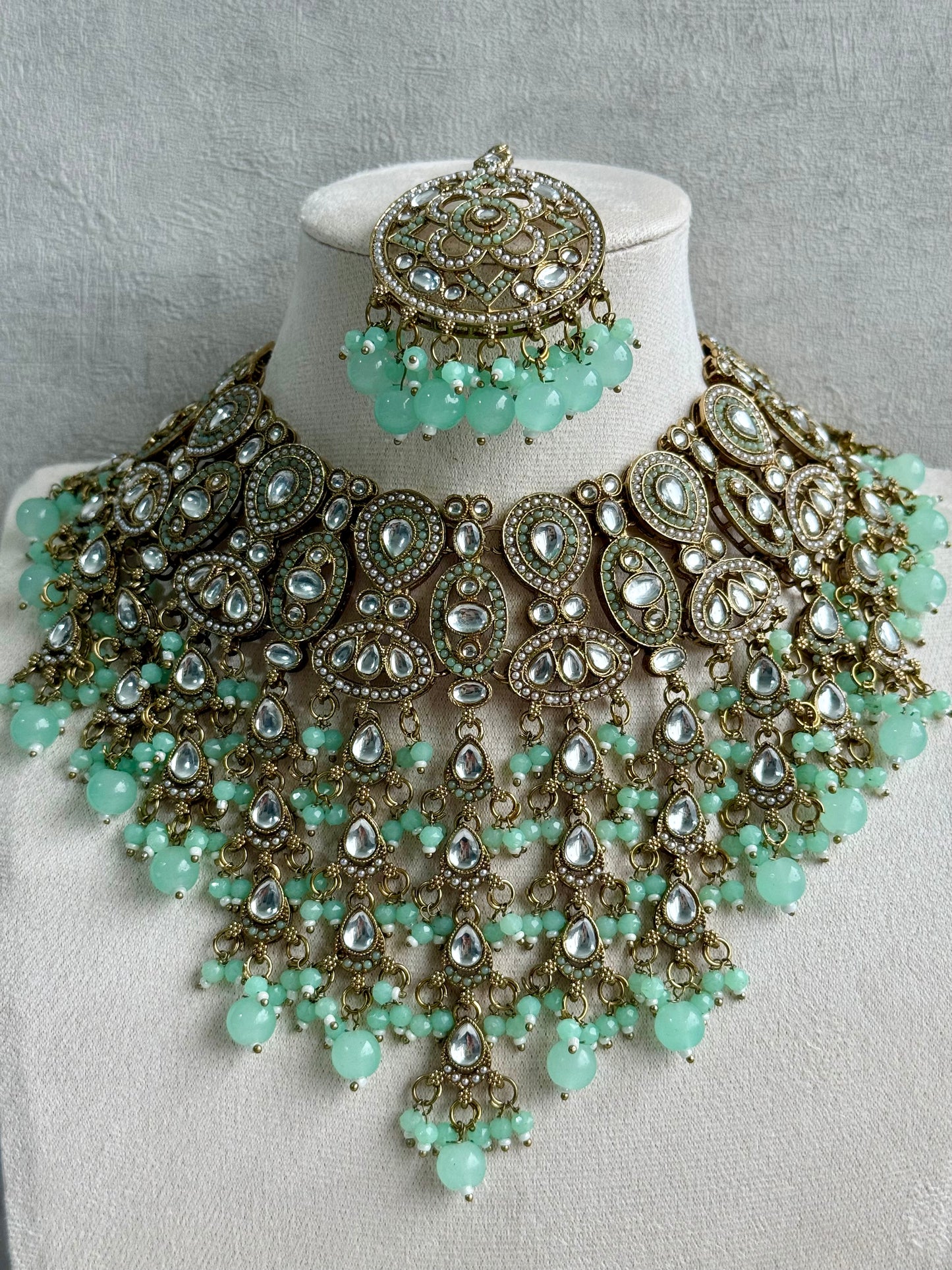 Ayura is Designs Tanya Bridal Set with Necklace, Earrings & Tikka – Pistachio Mint Beads, Mirror-Cut Stones and Antique Gold Finish
