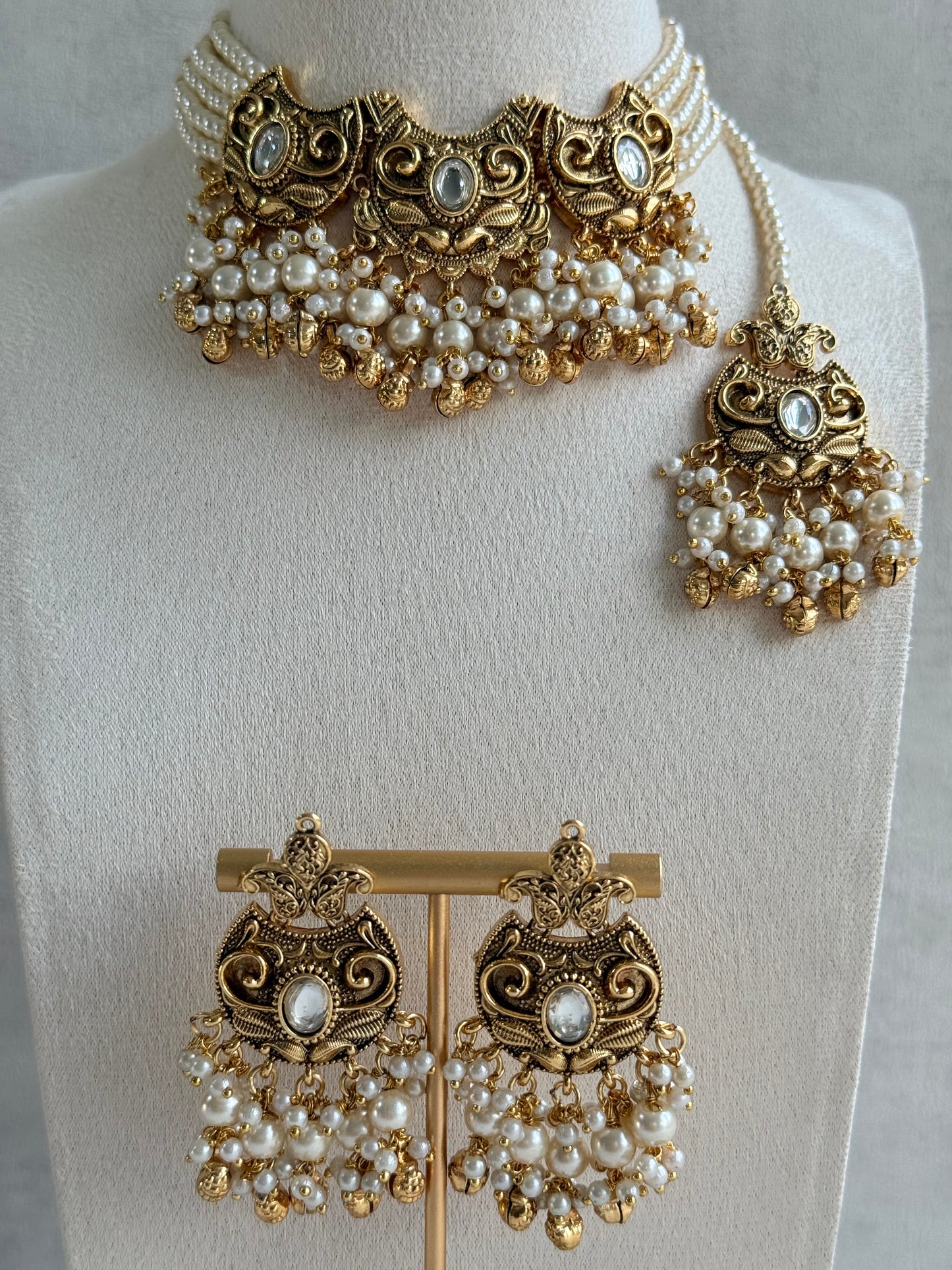 Ayura Designs Sneha Choker Set with Earrings & Tikka – Ivory Beads, Layered Pearl Detailing, Ghungroos & Antique Gold Finish